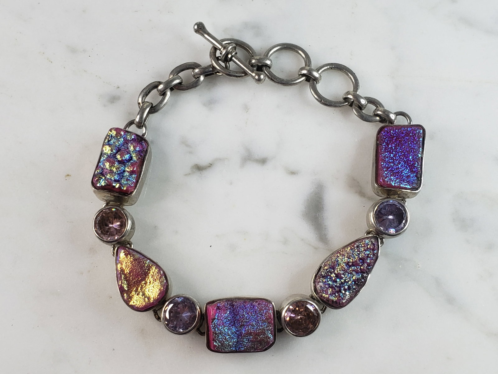 Womens Vintage Estate Sterling Silver Modernist Multi Stone Bracelet: A WOMENS VINTAGE ESTATE STERLING SILVER MODERNIST MULTI STONE BRACELET. NOT SURE IF STONES ARE NATURAL OR MAN MADE. BRACELET MEASURES 8 1/2" LONG BY 1/2" WIDE AND WEIGHS 32.6g. THIS WOULD MAKE A LOVEL