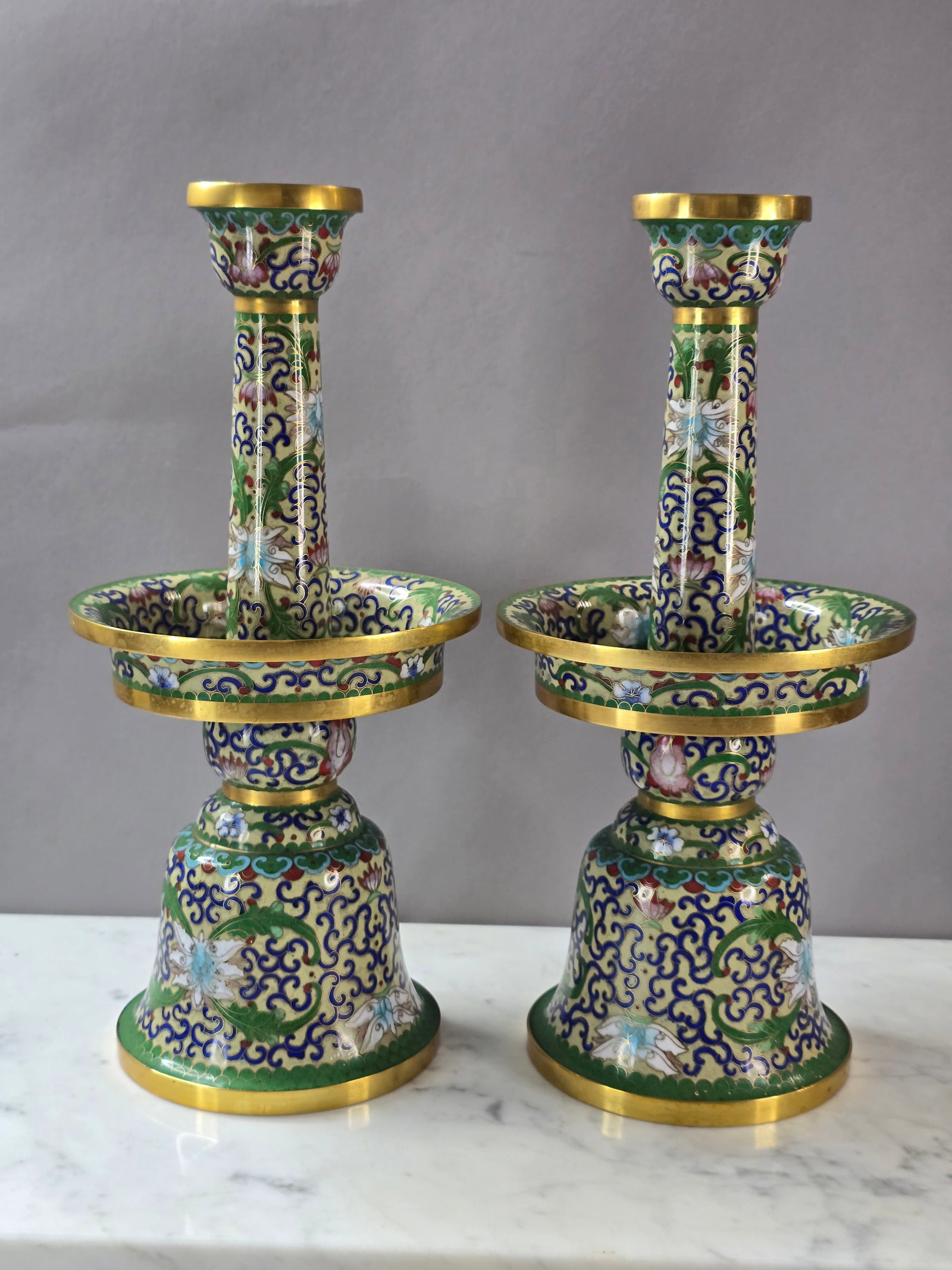 VINTAGE ANTIQUE CHINESE CLOISONNE LOTUS FLOWER CANDLESTICKS: A PAIR OF VINTAGE ANTIQUE CHINESE CLOISONNE LOTUS FLOWER CANDLESTICKS. CANDLESTICKS EACH MEASURE ABOUT 14 1/4" TALL BY ABOUT 5 1/2" WIDE. CONDITION LOOKS GOOD FOR THEIR AGE. LOTS OF GREAT DETAIL. I DO