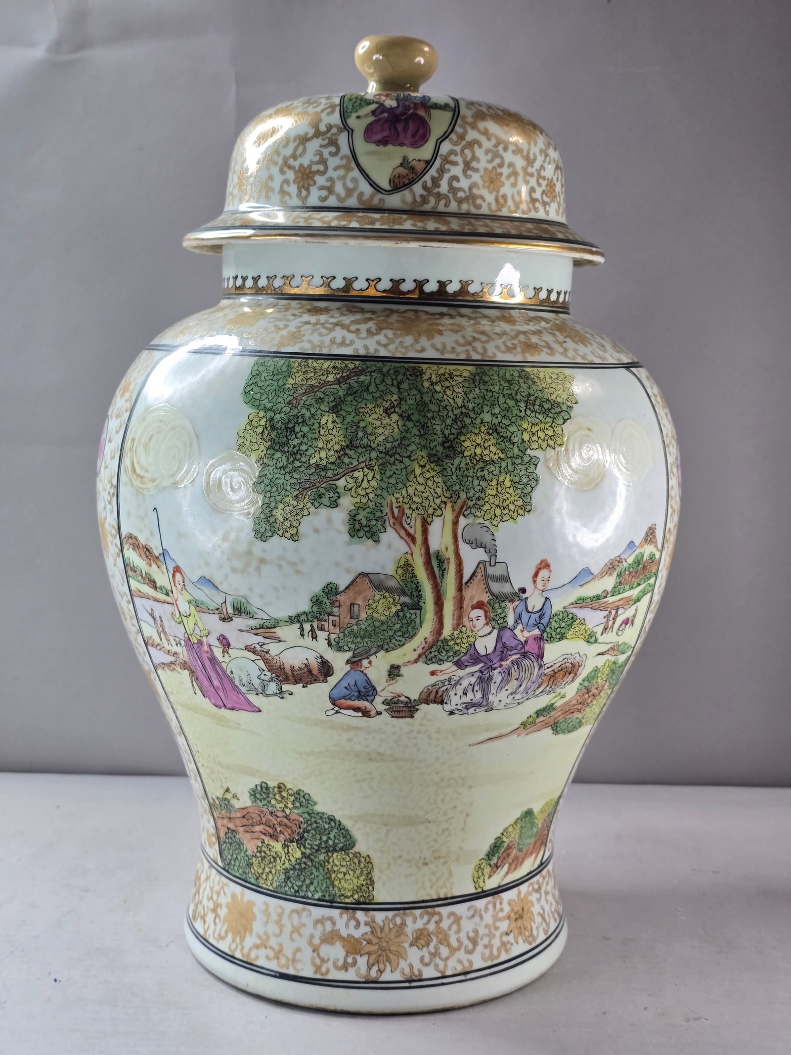 Decorative Vintage Antique Chinoiserie Porcelain Picnic Scene Vase Urn: A beautiful vintage antique Chinoiserie style picnic an rum running scene vase or urn that measures about 17 1/2" by about 10 1/2". Condition is very good, no chips or cracks. Not sure who the maker i