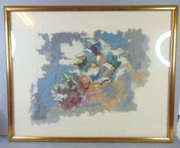 Vintage Modern Abstract Fabric Artwork: A VINTAGE MODERN ABSTRACT FABRIC ARTWORK THAT MEASURES 36 5/8" BY 30" WITH THE FRAME. CONDITION IS GOOD FOR ITS AGE BUT THE FRAME DOES HAVE SOME BLEMISHES.NOT SURE WHO THE ARTIST IS AS THE ARTWORK IS 