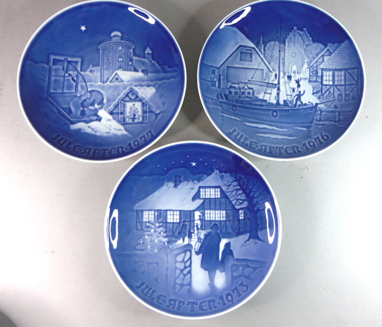 Lot of 6 Vintage Collectible Royal Copenhagen Christmas Porcelain Plates: FOR SALE IS THIS SET OF 6 COLLECTIBLE DECORATIVE ROYAL COPENHAGEN CHRISTMAS PORCELAIN PLATES. THE PLATES MEASURE 7 1/4" IN DIAMETER. PLATES COME WITH A WIRE TO HANG ON WALL AND DISPLAY. LOT INCLUDES Y