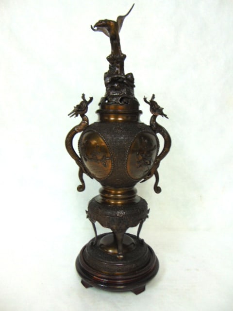 ANTIQUE CHINESE BRONZE ? CENSER W/ DRAGONS: A BEAUTIFUL ANTIQUE CHINESE CENSER WITH DRAGON HANDLES AND WHAT LOOKS LIKE AN EAGLE ON THE LID. THE CENSER MEASURES ABOUT 23" TALL BY ABOUT 10" WIDE FROM HANDLE TO HANDLE. I BELEIVE THIS PIECE IS FROM