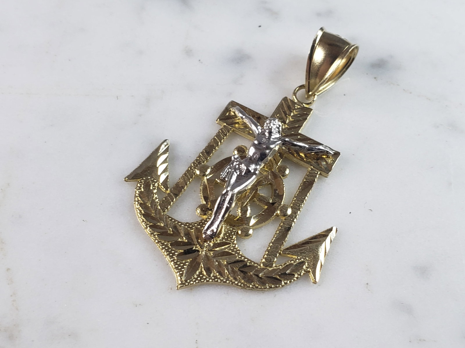 Vintage Estate 10K Yellow Gold Religious Jesus on Cross & Anchor Pendant: A VINTAGE ESTATE 10K YELLOW & WHITE GOLD JESUS ON A CROSS AND ANCHOR PENDANT. THE PENDANT WEIGHS 6.1g AND MEASURES 2" LONG BY 1 1/4" WIDE. PENDANT IS MARKED ON THE BALE. MAKES A GREAT GIFT FOR THAT SO