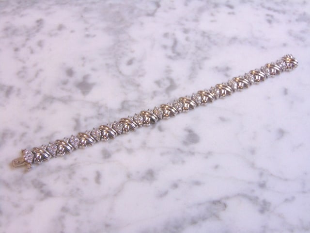 Womens Vintage Estate 14K White Gold Diamond Bracelet: A LOVELY VINTAGE ESTATE 14K WHITE GOLD BRACELET WITH DIAMONDS. THE BRACELET WEIGHS 26.0g. BRACELET MEASURES ABOUT 7" LONG BY 3/8" WIDE. THERE ARE ABOUT 4.2cts OF DIAMONDS IN THE BRACELET. WOULD MAKE A