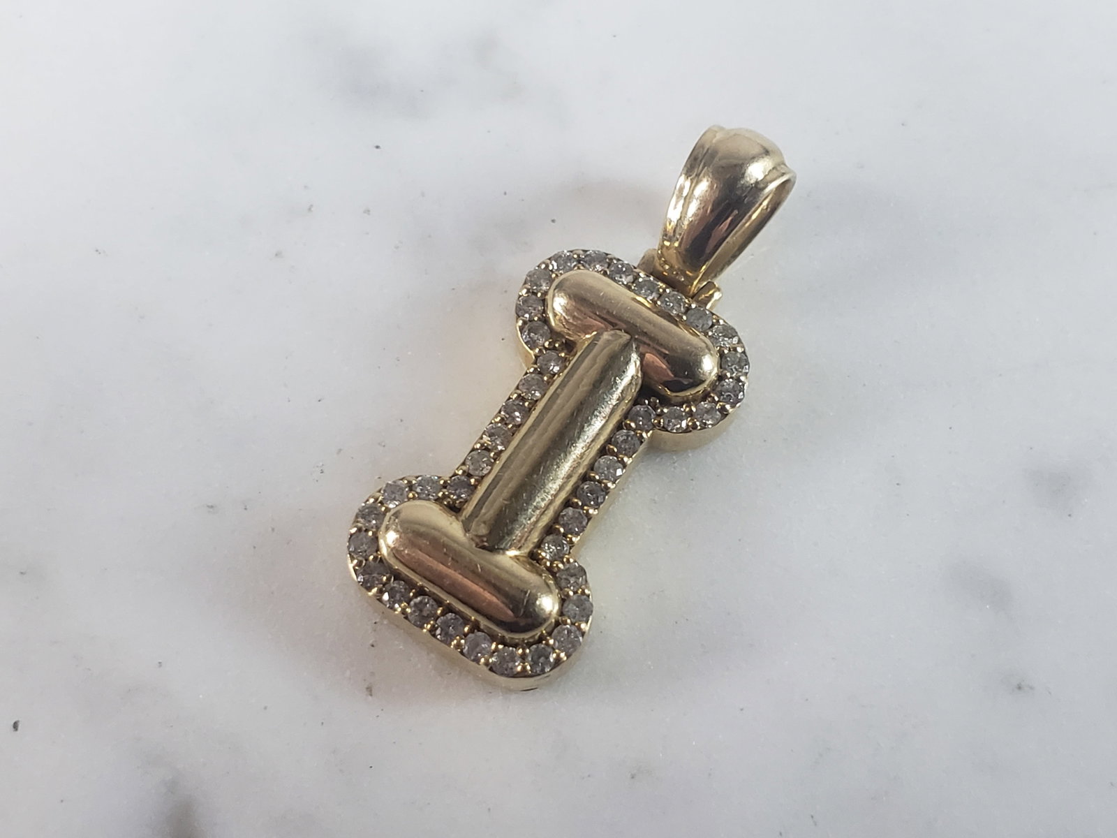 Womens Vintage Estate 14K Yellow Gold Letter I Diamond Pendant: FOR SALE IS THIS LOVELY VINTAGE ESTATE 14K YELLOW GOLD & DIAMOND LETTER "I" PENDANT. PENDANT WEIGHS 4.4g AND MEASURES 1 1/8" BY 1/2". THERE ARE ABOUT 1.20cts OF DIAMONDS. PENDANT IS MARKED ON THE BALE