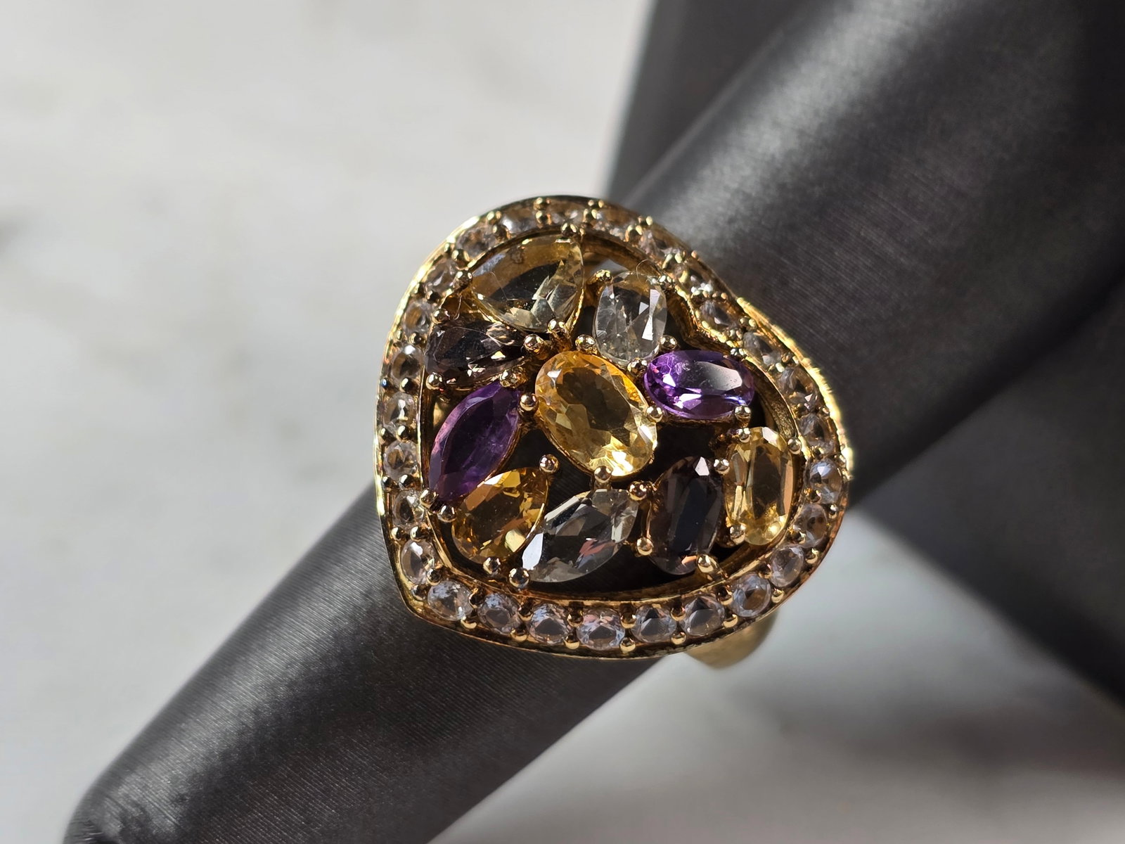 Womens Sterling Silver Gold Tone Modernist Multi Stone Heart Ring: A WOMEN'S VINTAGE ESTATE STERLING SILVER MODERNIST GOLD TONE MULTI STONE HEART RING. THE RING SIZE IS A 7.0, AND WEIGHS 7.1g. THE WIDTH OF THE RING IS 3/4". NOT SURE IF THE STONES ARE NATURAL OR MAN M