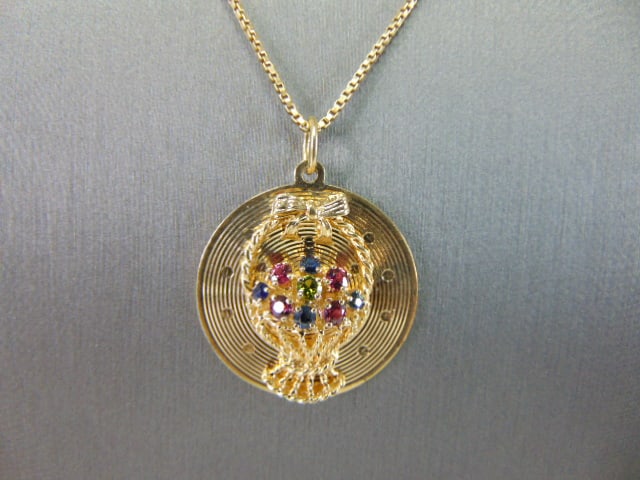 Womens 14K Yellow Gold Basket Pendant Necklace: A WOMENS VINTAGE ESTATE 14k GOLD BASKET PENDANT WITH NECKLACE. TOGETHER THEY WEIGH 11.6g. THE PENDANT MEASURES 1 1/4" LONG BY 1" WIDE, AND THE NECKLACE MEASURES 20 1/4" LONG. THE STONES IN THE PENDANT
