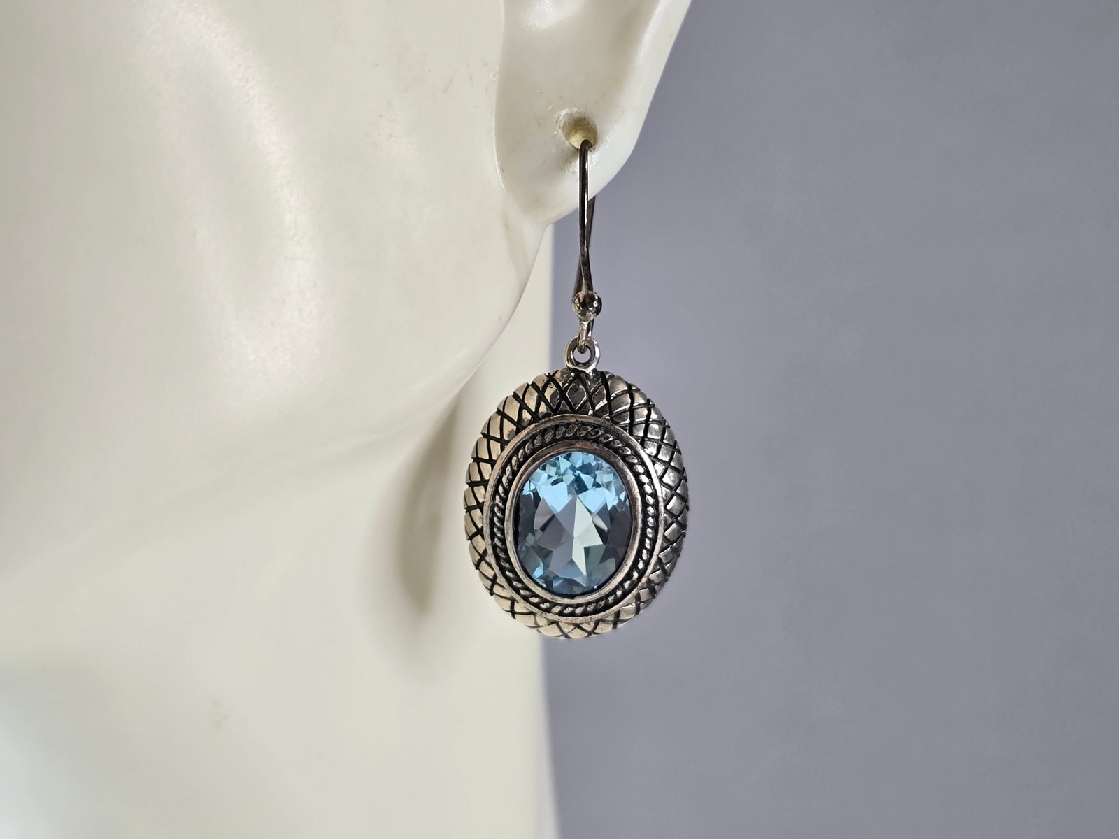 Womens Vintage Estate Sterling Silver Modernist Topaz Earrings: A PAIR OF WOMENS VINTAGE ESTATE STERLING SILVER MODERNIST TOPAZ COLORED EARRINGS THAT WEIGH 6.9g, AND MEASURE 1 1/8" LONG BY 5/8" WIDE. NOT SURE IF STONES ARE NATURAL OR MAN MADE. ANY QUESTIONS, PLEAS