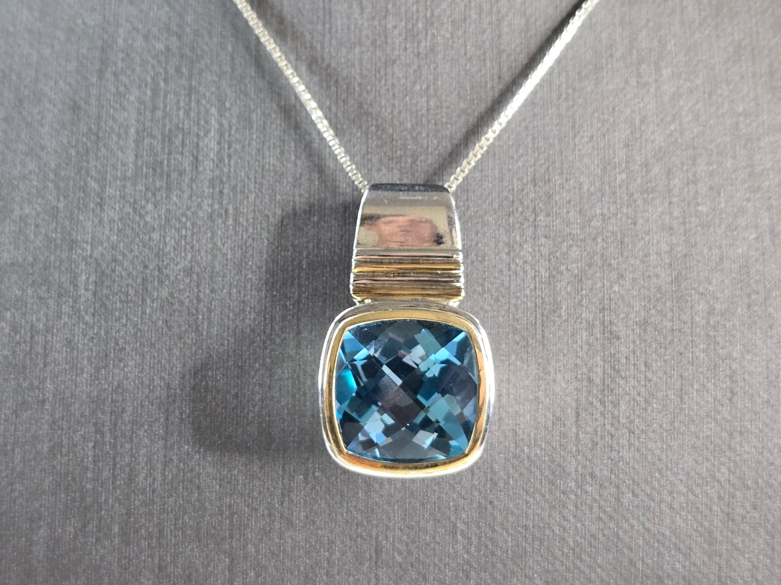 Womens Vintage Estate Sterling Silver Topaz Pendant Necklace: A WOMENS VINTAGE ESTATE STERLING SILVER TOPAZ COLORED MODERNIST PENDANT NECKLACE. NOT SURE IF THE STONE IS NATURAL OR MAN MADE. THE TOTAL WEIGHT IS 17.9g. NECKLACE IS 18" LONG, AND THE PENDANT IS 1 1/