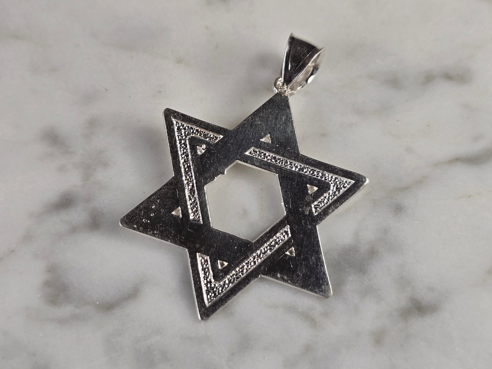 Sterling Silver Jewish Judaica Star of David Religious Pendant: A STERLING SILVER STAR OF DAVID PENDANT. THE PENDANT WEIGHS 2.5g AND MEASURES 1 1/2" LONG BY 1 1/8" WIDE. MAKES A GREAT GIFT FOR THAT SOMEONE SPECIAL. ANY QUESTIONS, PLEASE ASK. BE SURE TO CHECK OUT O