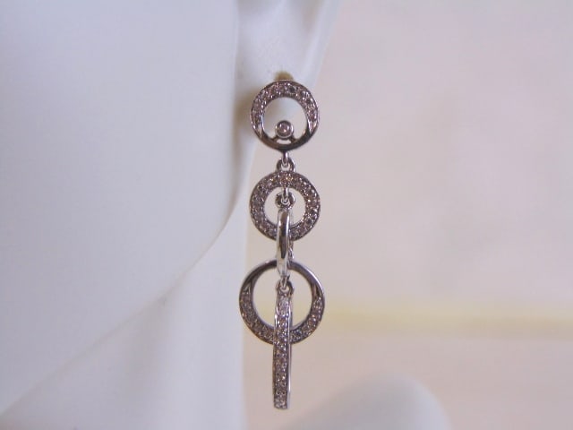 Womens Vintage Sterling Silver Earrings w/ CZ Stones: A PAIR OF WOMENS STERLING SILVER DANGLE EARRINGS WITH CZ STONES THAT WEIGH 4.0g AND MEASURES 1 3/8" LONG BY 3/8" WIDE. ANY OTHER QUESTIONS, PLEASE DO NOT HESITATE TO ASK. BE SURE TO CHECK OUT SOME OF 