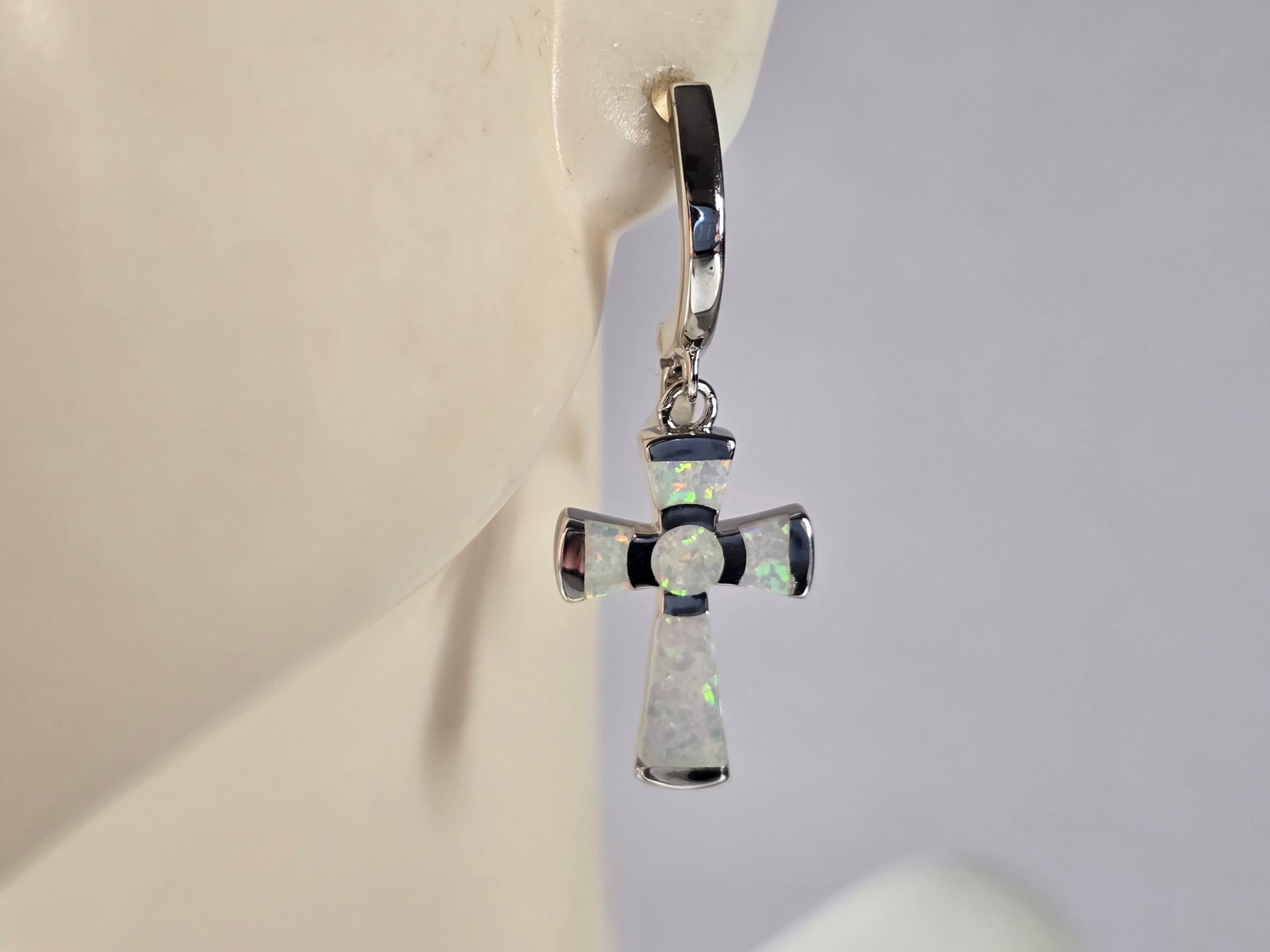 Womens Estate Sterling Silver Opal Cross Earrings: A PAIR OF WOMENS STERLING SILVER OPAL COLORED CROSS EARRINGS THAT WEIGH 4.2g, AND MEASURES 1 1/4" LONG BY 1/2" WIDE. NOT SURE IF STONES ARE REAL OR MAN MADE. ANY QUESTIONS, PLEASE DO NOT HESITATE TO A