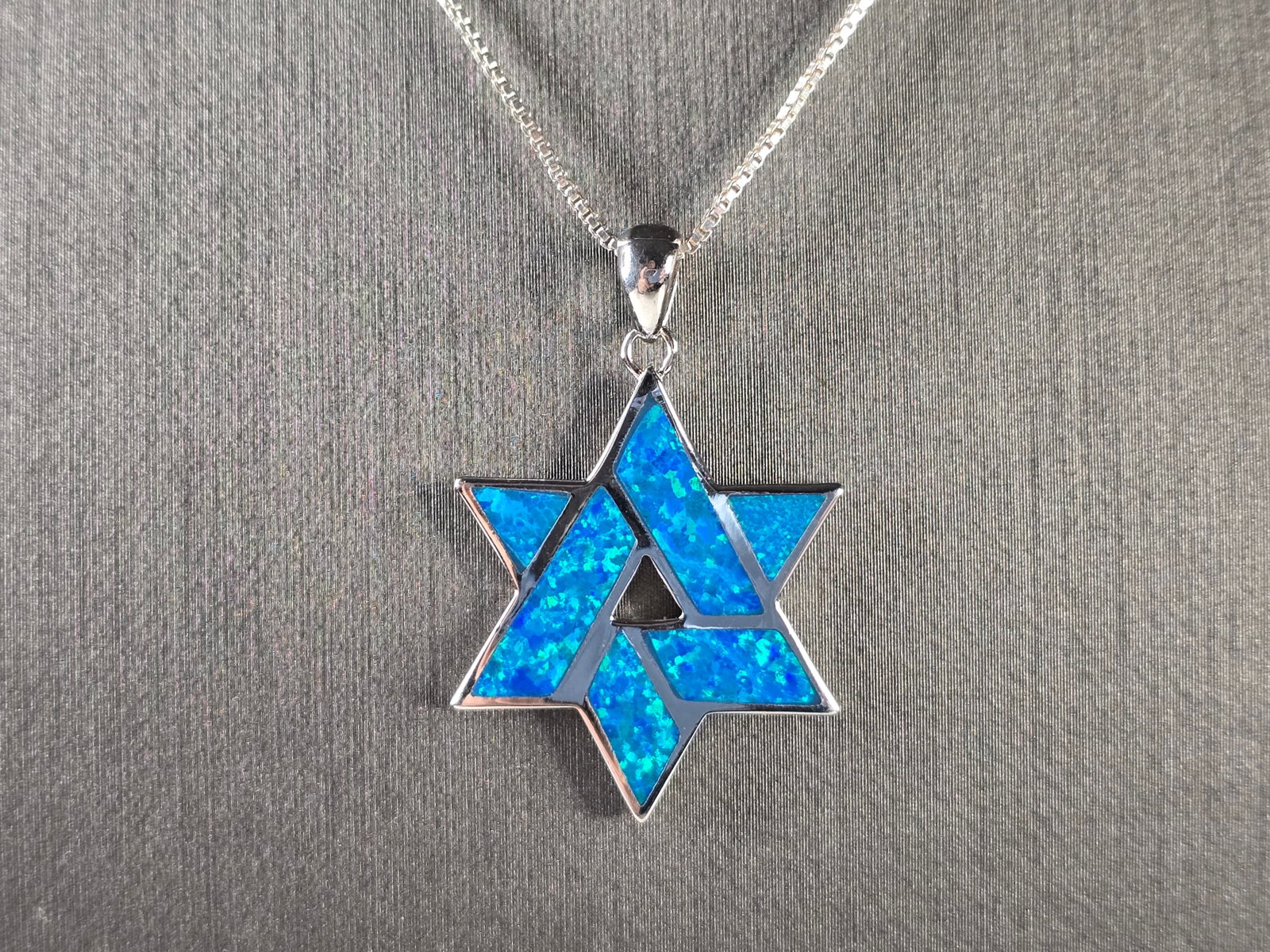 Sterling Silver Jewish Judaica Star of David Opal Pendant Necklace: A VINTAGE ESTATE STERLING SILVER MODERNIST STAR OF DAVID OPAL PENDANT WITH NECKLACE. THE PENDANT AND NECKLACE TOGETHER WEIGH 6.4g. THE NECKLACE MEASURES 18 1/2", AND THE PENDANT MEASURES 1 1/4" LONG B