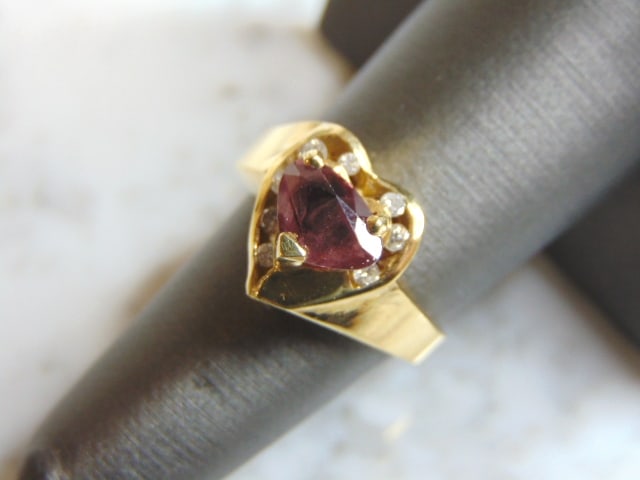 Womens Vintage Estate 14K Yellow Gold Ruby Diamond Heart Ring: A WOMENS VINTAGE ESTATE 14K YELLOW GOLD RUBY WITH DIAMOND HEART RING. THE RING WEIGHS 6.6g, AND IS A SIZE 6.5. THE FACE OF THE RING MEASURES ABOUT 1/2" BY 1/2". ANY QUESTIONS PLEASE DO NOT HESITATE TO