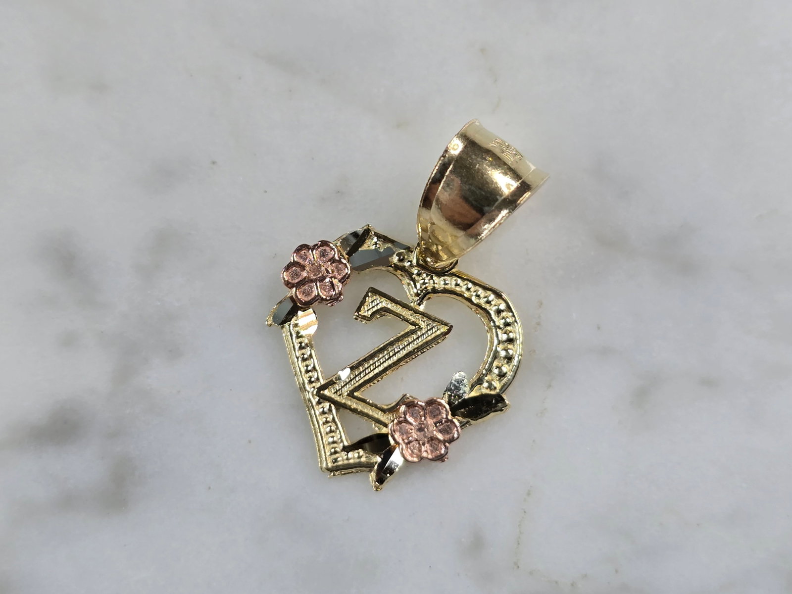 Womens 10K Yellow & Rose Gold Initial Letter " Z " Heart Pendant: A WOMENS 10K YELLOW & ROSE GOLD "Z" HEART PENDANT. PENDANT MEASURES 3/4" LONG BY 5/8" WIDE. TOTAL WEIGHT OF THE PENDANT IS 0.9g. WOULD MAKE A LOVELY GIFT FOR THAT SOMEONE SPECIAL. ANY QUESTIONS PLEASE