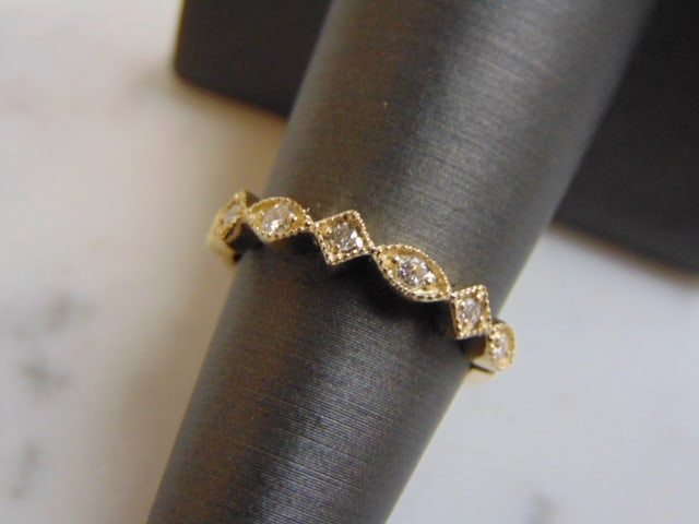 Women's 14K Yellow Gold Diamond Ring: FOR SALE IS THIS 14K WHITE GOLD DIAMOND RING WITH ABOUT .16cts OF DIAMONDS IN IT. THE RING WEIGHS 2.5g. THE SIZE OF THE RING IS A 5.75. THE WIDTH OF THE RING IS 1/8". THIS MAKES A LOVELY GIFT FOR THAT