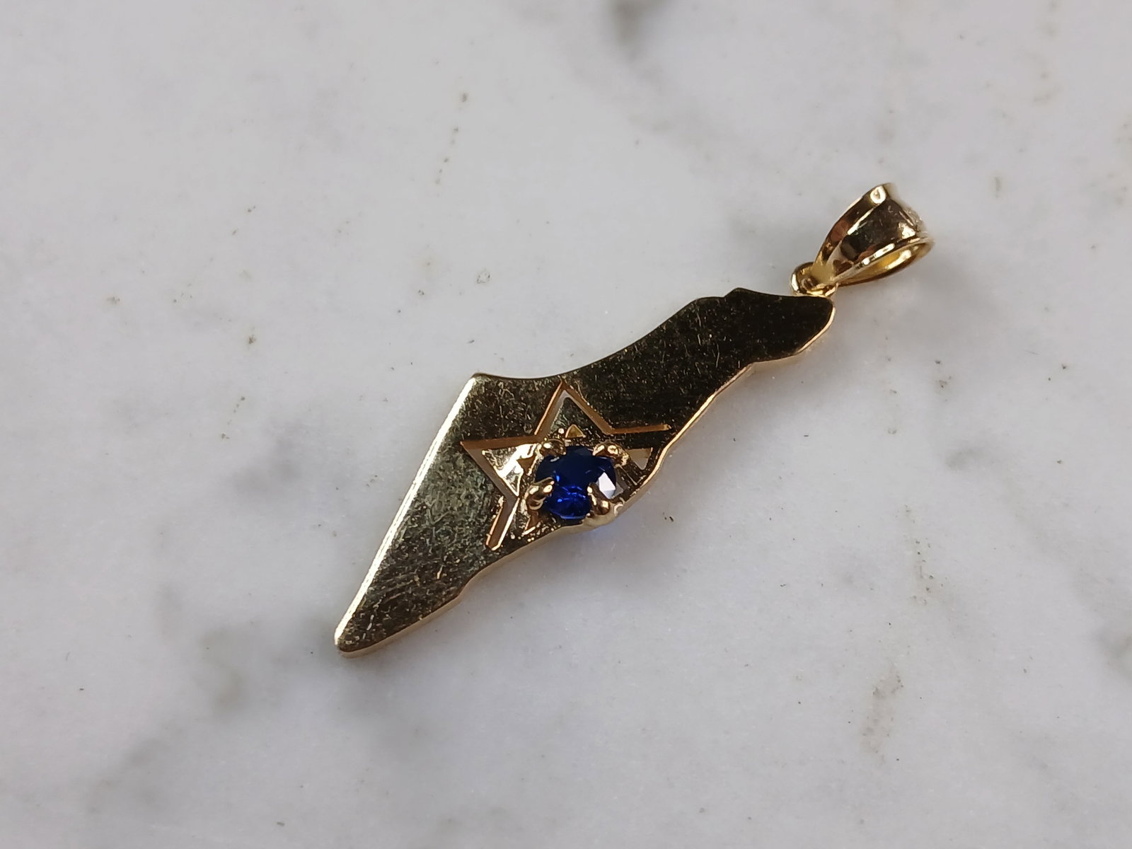 Sterling Silver Gold Tone Jewish Judaica Star of David Israel Pendant: A STERLING SILVER GOLD TONE JUDAICA STAR OF DAVID PENDANT IN THE SHAPE OF ISRAEL. THE PENDANT WEIGHS 3.0g AND MEASURES 1 3/4" LONG BY 1/2" WIDE. PENDANT IS MARKED ON THE BALE. MAKES A GREAT GIFT FOR T