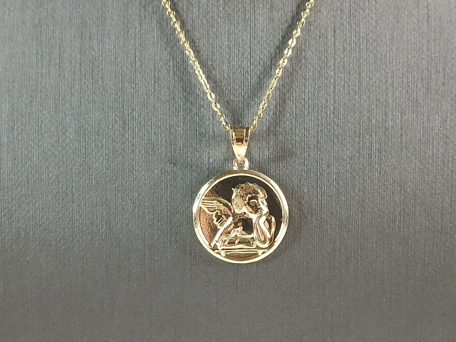 Womens Sterling Silver Gold Tone Guardian Angel Pendant Necklace: A WOMENS STERLING SILVER GOLD TONE ANGEL PENDANT WITH NECKLACE. THE PENDANT WITH NECKLACE WEIGHS 4.2g. THE NECKLACE MEASURES 18" LONG AND IS ADJUSTABLE TO 16". THE PENDANT MEASURES 1" BY 3/4". MAKES A