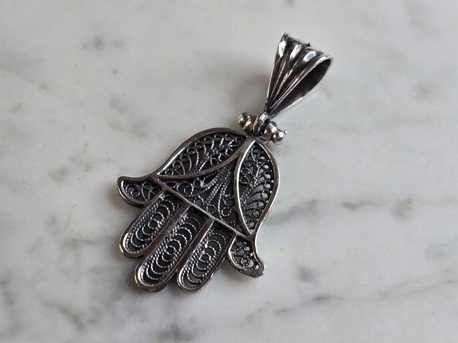 Womens Estate Sterling Silver Hamsa Hand Pendant: AN ESTATE STERLING SILVER HAMSA HAND PENDANT. THE PENDANT WEIGHS 5.0g, AND MEASURES 1 3/1" BY 1". MAKES A GREAT GIFT FOR THAT SPECIAL SOMEONE. ANY QUESTIONS, PLEASE DO NOT HESITATE TO ASK.