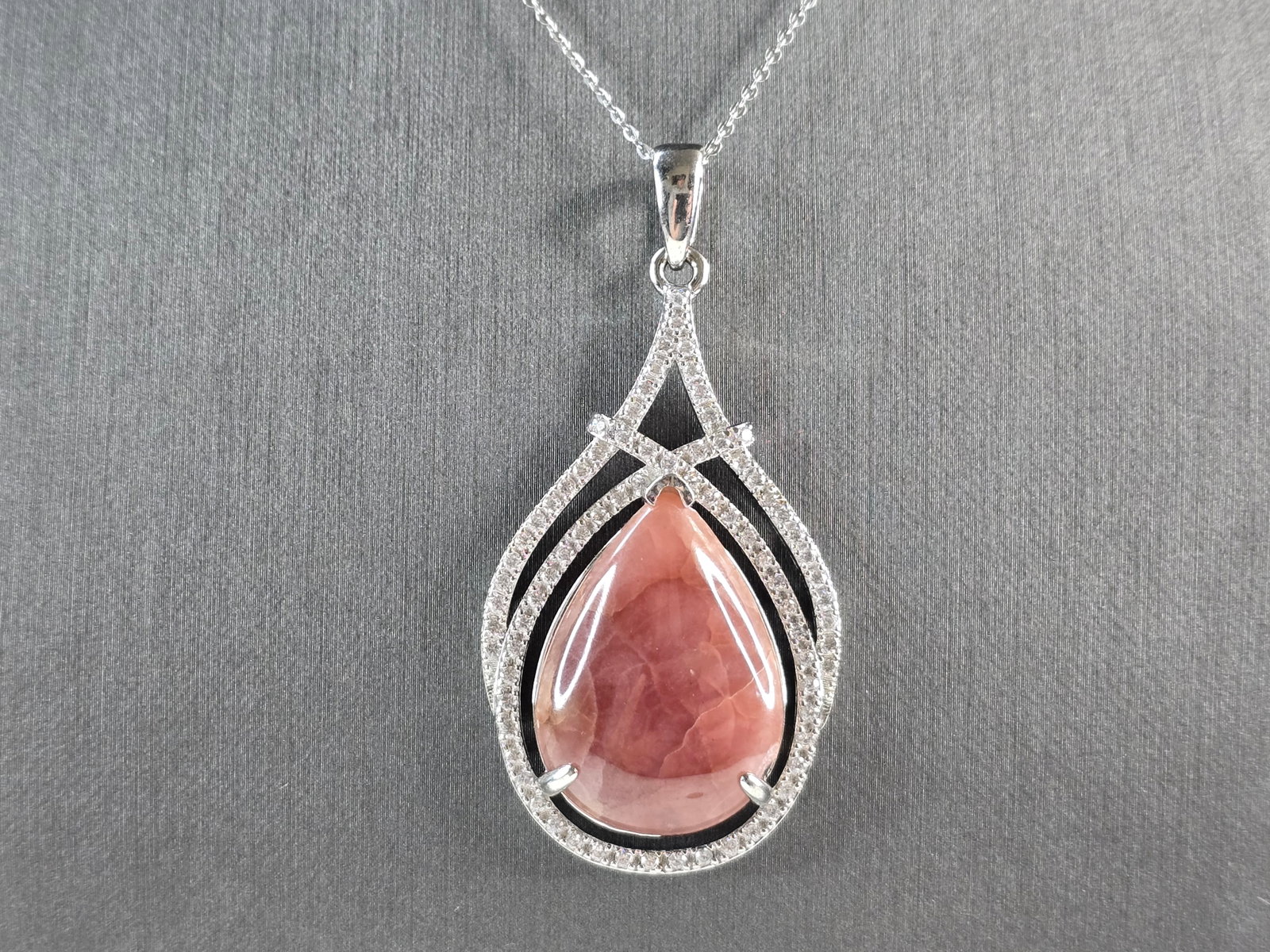 Womens Sterling Silver Modernist Rhodochrosite CZ Pendant Necklace: A WOMEN STERLING SILVER NECKLACE WITH WHAT APPEARS TO BE A RHODOCHROSITE & CZ PENDANT. THE PENDANT MEASURES 2 3/8" BY 1 1/4". THE NECKLACE MEASURES 18" LONG. TOGETHER THEY WEIGH 17.5g. NOT SURE IF THE