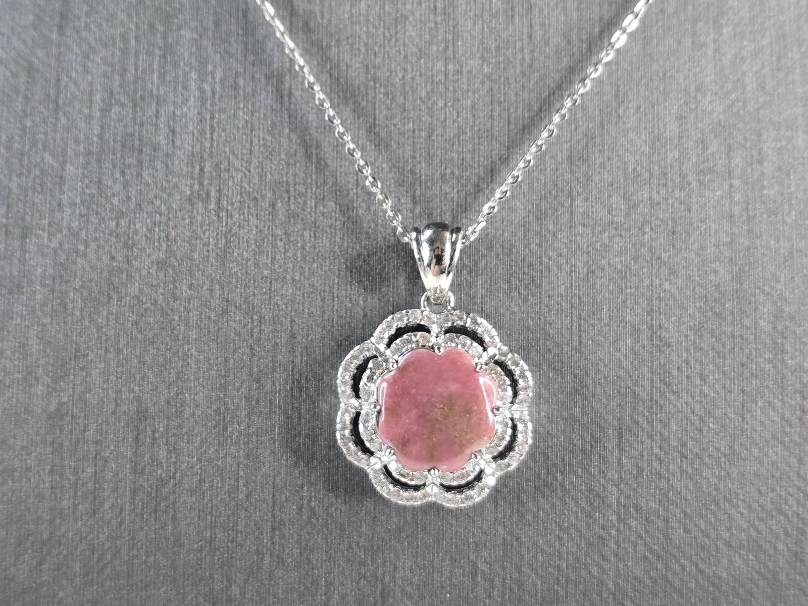 Womens Sterling Silver Modernist Rhodochrosite CZ Pendant Necklace: A WOMEN STERLING SILVER NECKLACE WITH WHAT APPEARS TO BE A RHODOCHROSITE & CZ PENDANT. THE PENDANT MEASURES 1 1/8" BY 7/8". THE NECKLACE MEASURES 18" LONG. TOGETHER THEY WEIGH 5.8g. NOT SURE IF THE ST