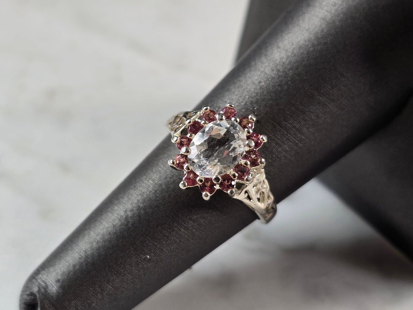 Womens Vintage Estate Sterling Silver CZ Pink Topaz Ring: A WOMENS VINTAGE ESTATE STERLING SILVER CZ PINK TOPAZ RING. RING WEIGHS 3.1g, AND IS A SIZE 7.0. THE WIDTH OF THE RING IS 1/2". NOT SURE IF STONES ARE NATURAL OR MAN MADE. THIS WOULD MAKE A NICE GIFT 