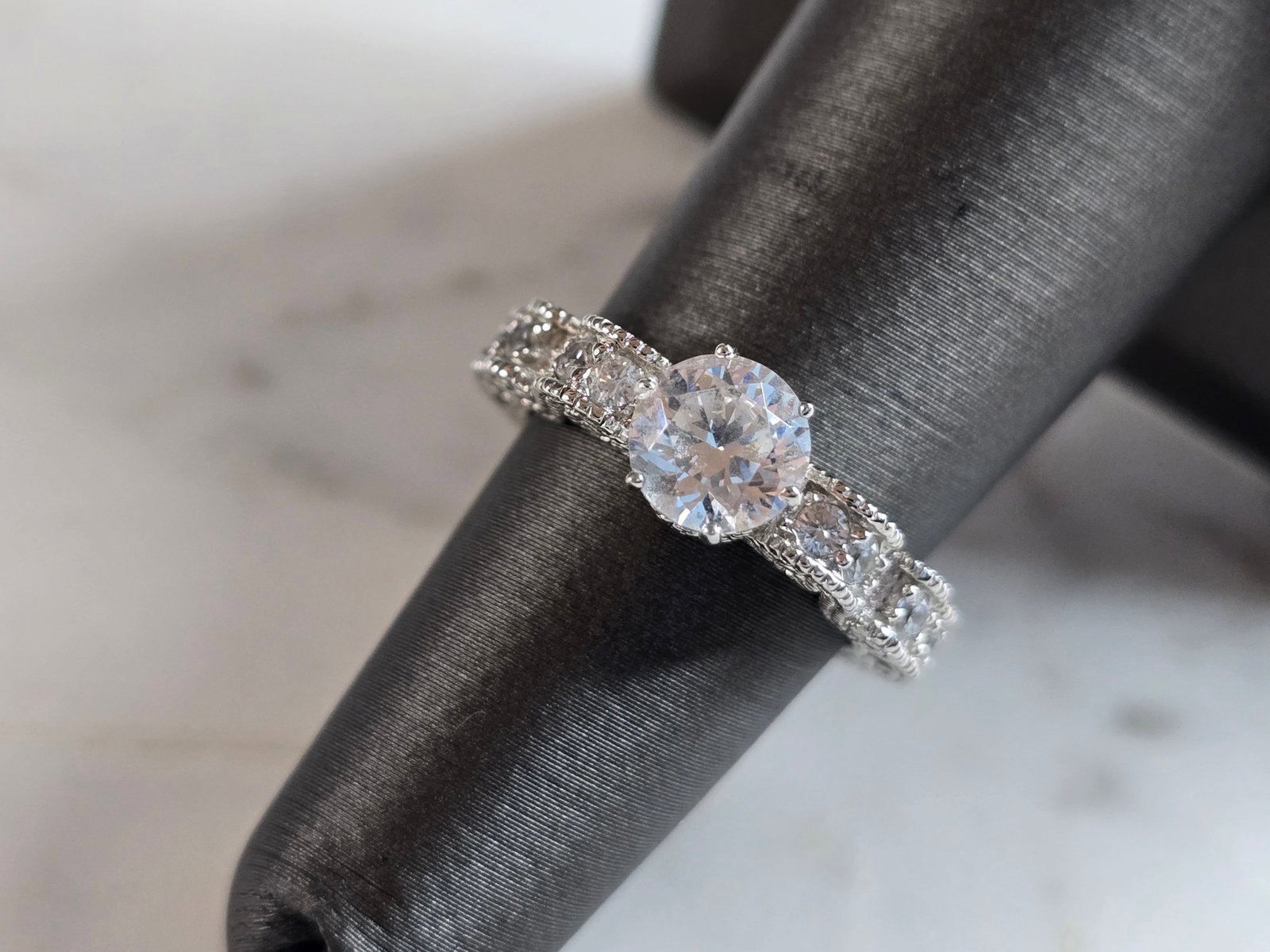 Womens Estate Sterling Silver Vanna K CZ Ring: A WOMENS ESTATE STERLING SILVER VANNA K CZ RING THAT WEIGHS 4.4g. THE RING IS A SIZE 5.25, AND MEASURES ABOUT 1/4" WIDE. THIS WOULD MAKE A NICE GIFT FOR THAT SOMEONE SPECIAL. ANY QUESTIONS PLEASE DO N