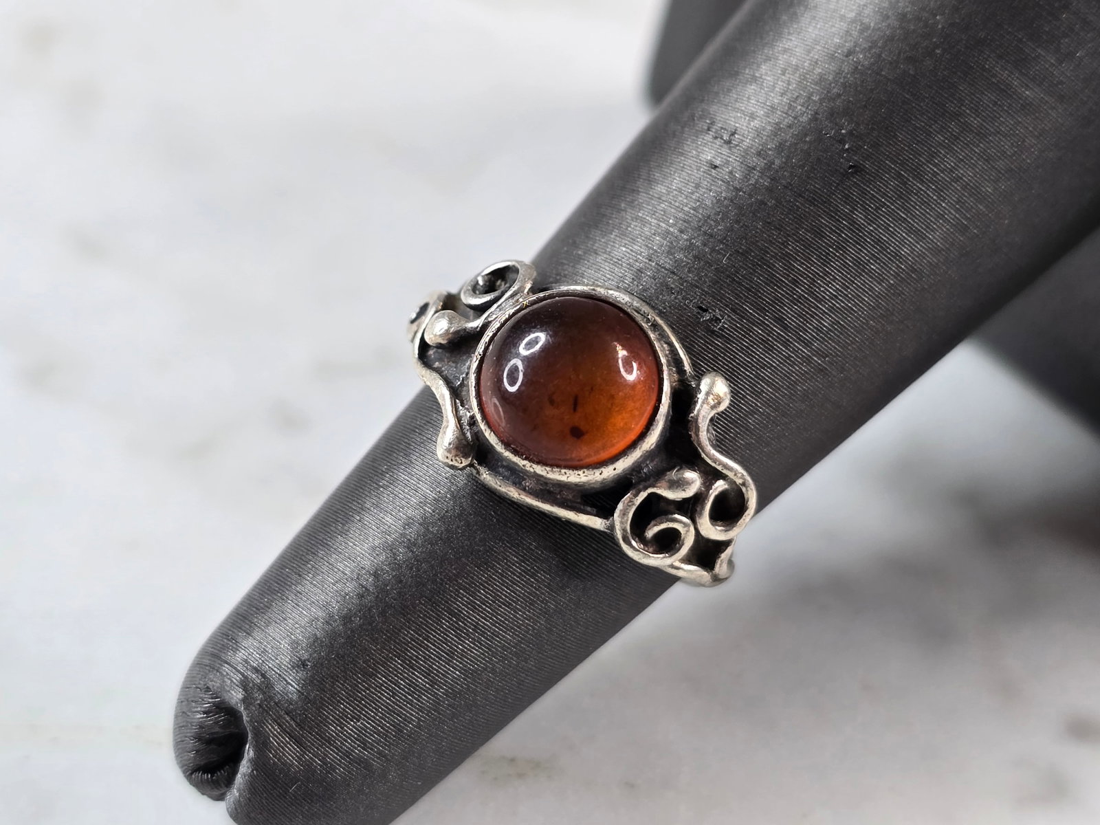 Womens Vintage Estate Sterling Silver Citrine Ring: A WOMENS VINTAGE ESTATE STERLING SILVER CITRINE COLORED RING. THE TOTAL WEIGHT IS 2.4g, AND IS A SIZE 4.75. THE WIDTH OF THE RING IS 3/8". RING IS MARKED ON THE OUTSIDE OF THE BAND. STONE IS MAN MADE.