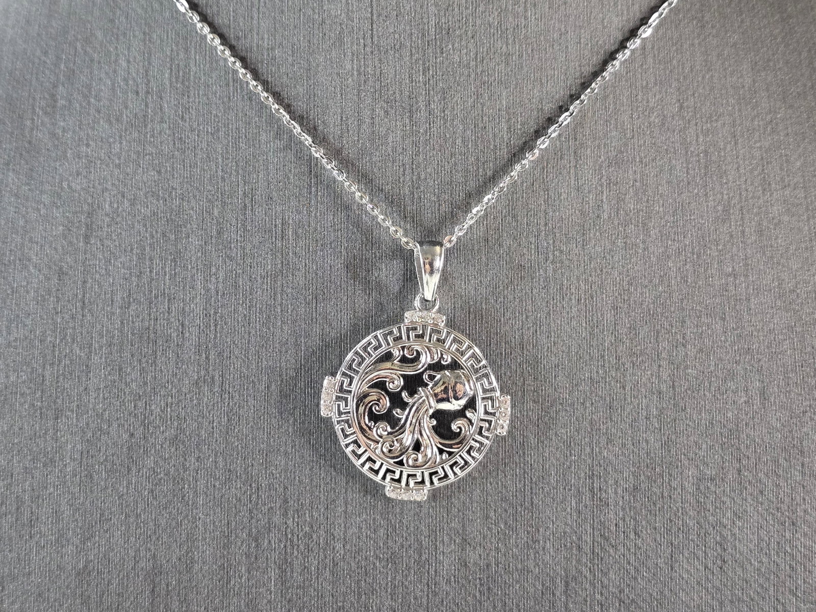 Womens Sterling Silver Aquarius Zodiac Pendant Necklace: A WOMENS VINTAGE ESTATE STERLING SILVER AQUARIUS ZODIAC PENDANT WITH NECKLACE. PENDANT WITH NECKLACE WEIGHS 3.5g. PENDANT MEASURES 1 1/4" LONG BY 7/8" WIDE. THE NECKLACE MEASURES 18" LONG. MAKES A GRE