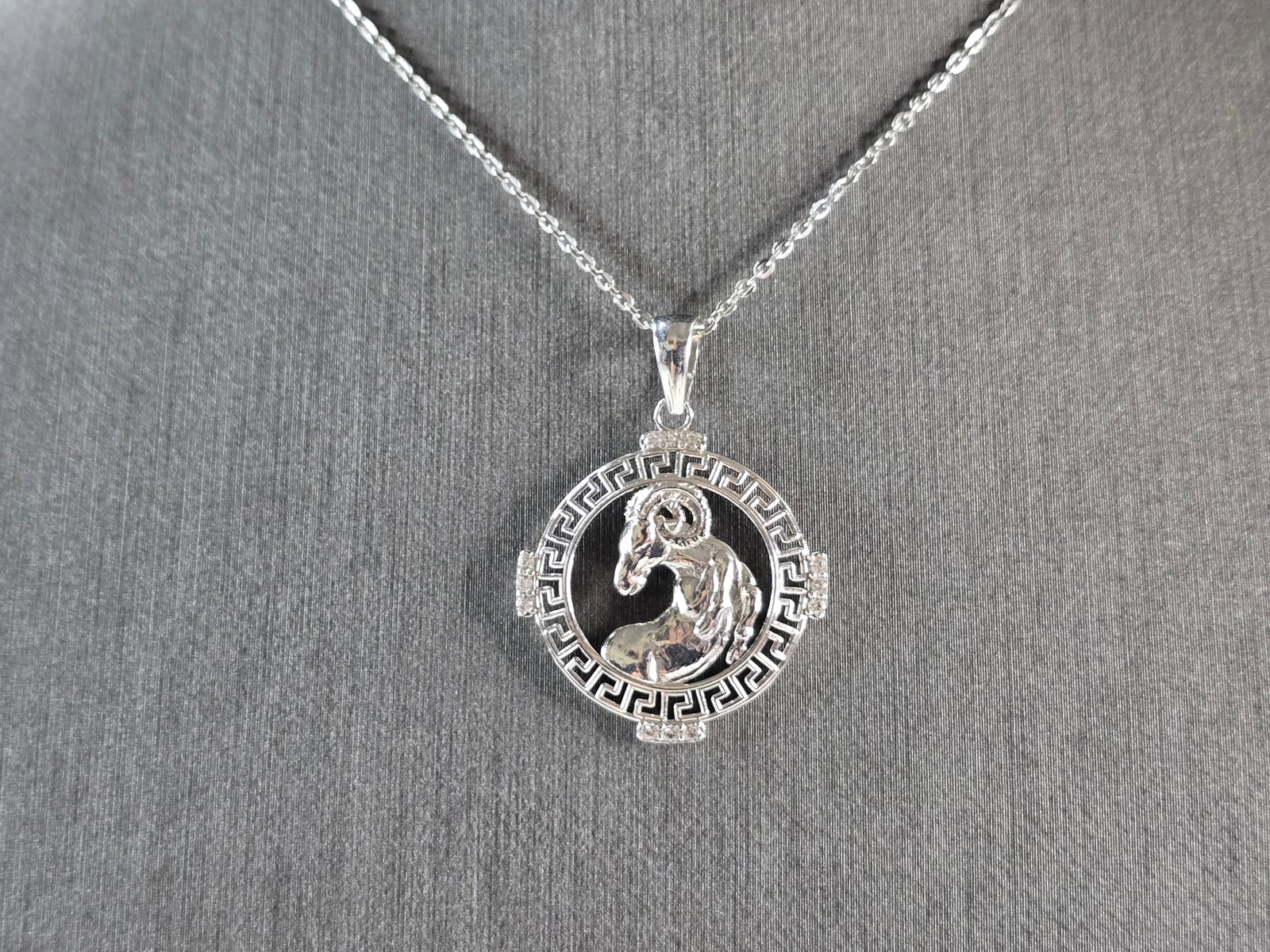Womens Sterling Silver Aries Zodiac Pendant Necklace: A WOMENS VINTAGE ESTATE STERLING SILVER ARIES ZODIAC PENDANT WITH NECKLACE. PENDANT WITH NECKLACE WEIGHS 3.5g. PENDANT MEASURES 1 1/4" LONG BY 7/8" WIDE. THE NECKLACE MEASURES 18" LONG. MAKES A GREAT 