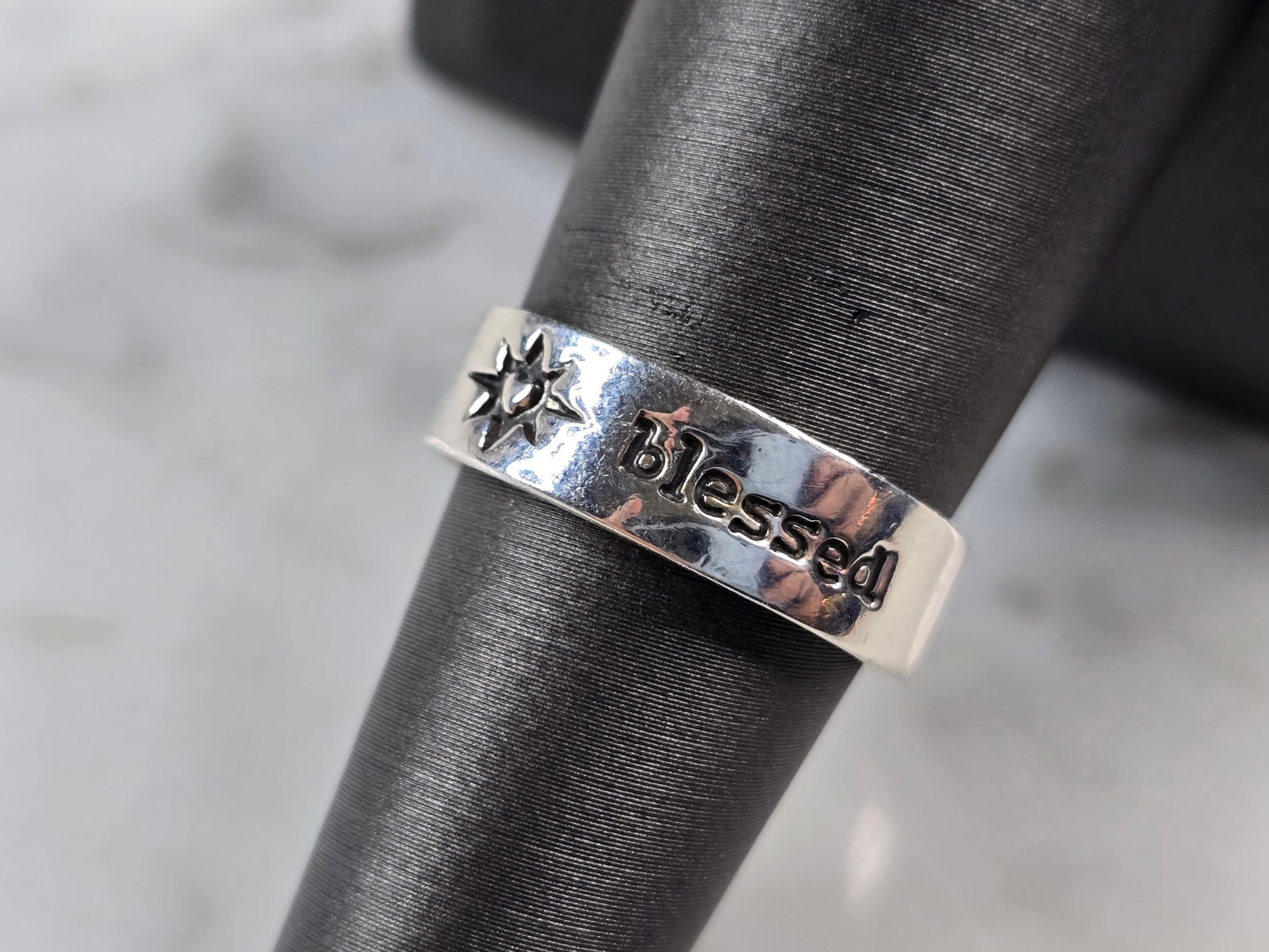 Womens Vintage Estate Sterling Silver Blessed Band Ring Fetched: A WOMENS VINTAGE ESTATE STERLING SILVER BLESSED RING, MADE BY FETCHED. RING IS A SIZE 7.0, AND WEIGHS 4.2g. THE WIDTH OF THE RING MEASURES ABOUT 1/4". THIS WOULD MAKE A NICE GIFT FOR THAT SOMEONE SPEC