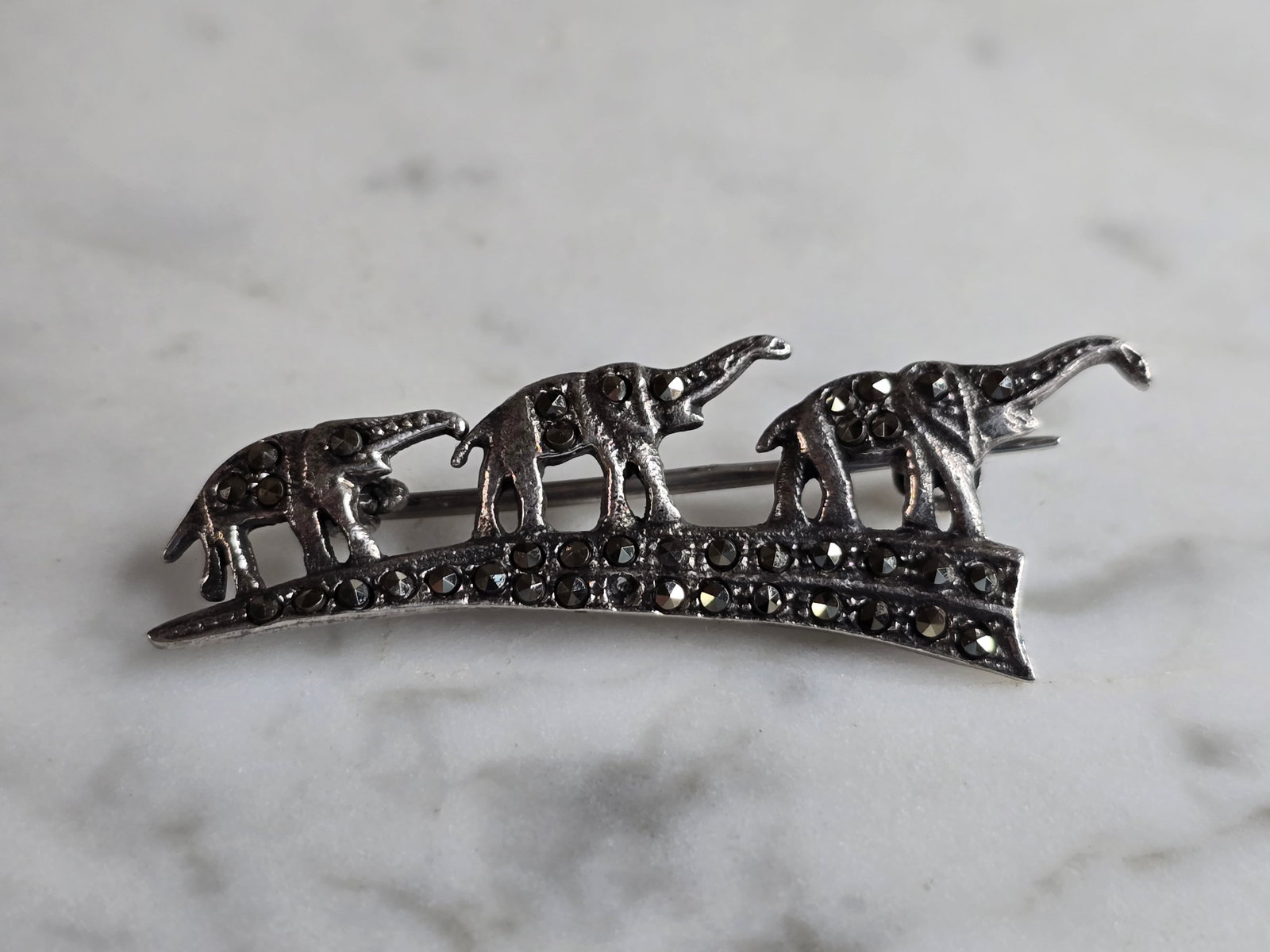 Womens Vintage Estate Sterling Silver Elephant Brooch: A WOMENS VINTAGE ESTATE STERLING SILVER ELEPHANT BROOCH. BROOCH WEIGHS 4.1G, AND MEASURES 1 3/4" BY 5/8". BROOCH IS MISSING ONE TINY STONE. MAKES A GREAT GIFT FOR THAT SPECIAL SOMEONE. ANY QUESTIONS, 