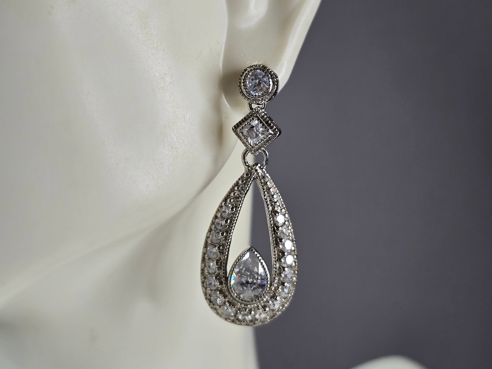 Womens Estate Sterling Silver CZ Earrings: WOMENS ESTATE STERLING SILVER CZ EARRINGS. THE EARRINGS MEASURE 1 1/2" BY 5/8" AND WEIGH 7.5g. WOULD MAKE A GREAT GIFT FOR THAT SPECIAL SOMEONE. ANY QUESTIONS PLEASE DO NOT HESITATE TO ASK. BE SURE TO