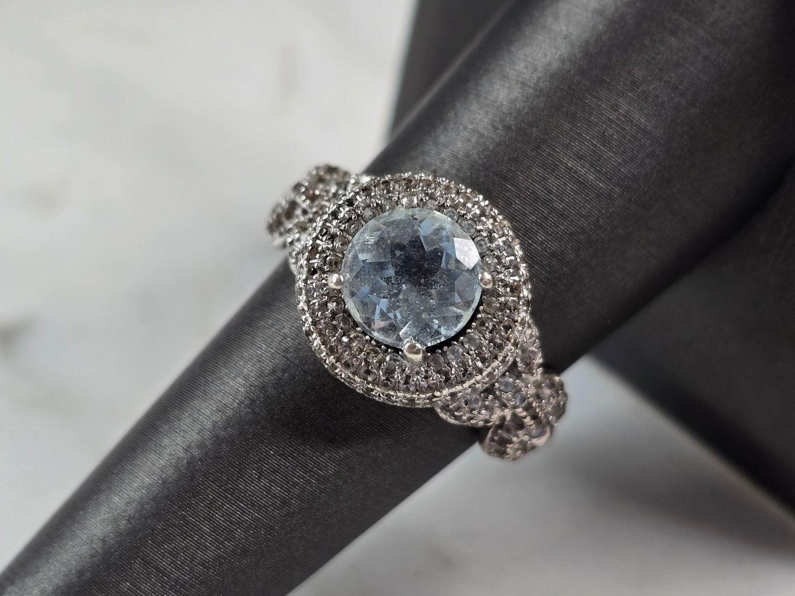 Womens Vintage Estate Sterling Silver Topaz CZ Ring: A WOMENS VINTAGE ESTATE STERLING SILVER TOPAZ COLORED RING WITH CZ ACCENTS. NOT SURE IF THE STONE IS NATURAL OR MANMADE. THE RING WEIGHS 5.1g, AND MEASURES 1/2" WIDE. THE SIZE OF THE RING IS AN 8.0. A