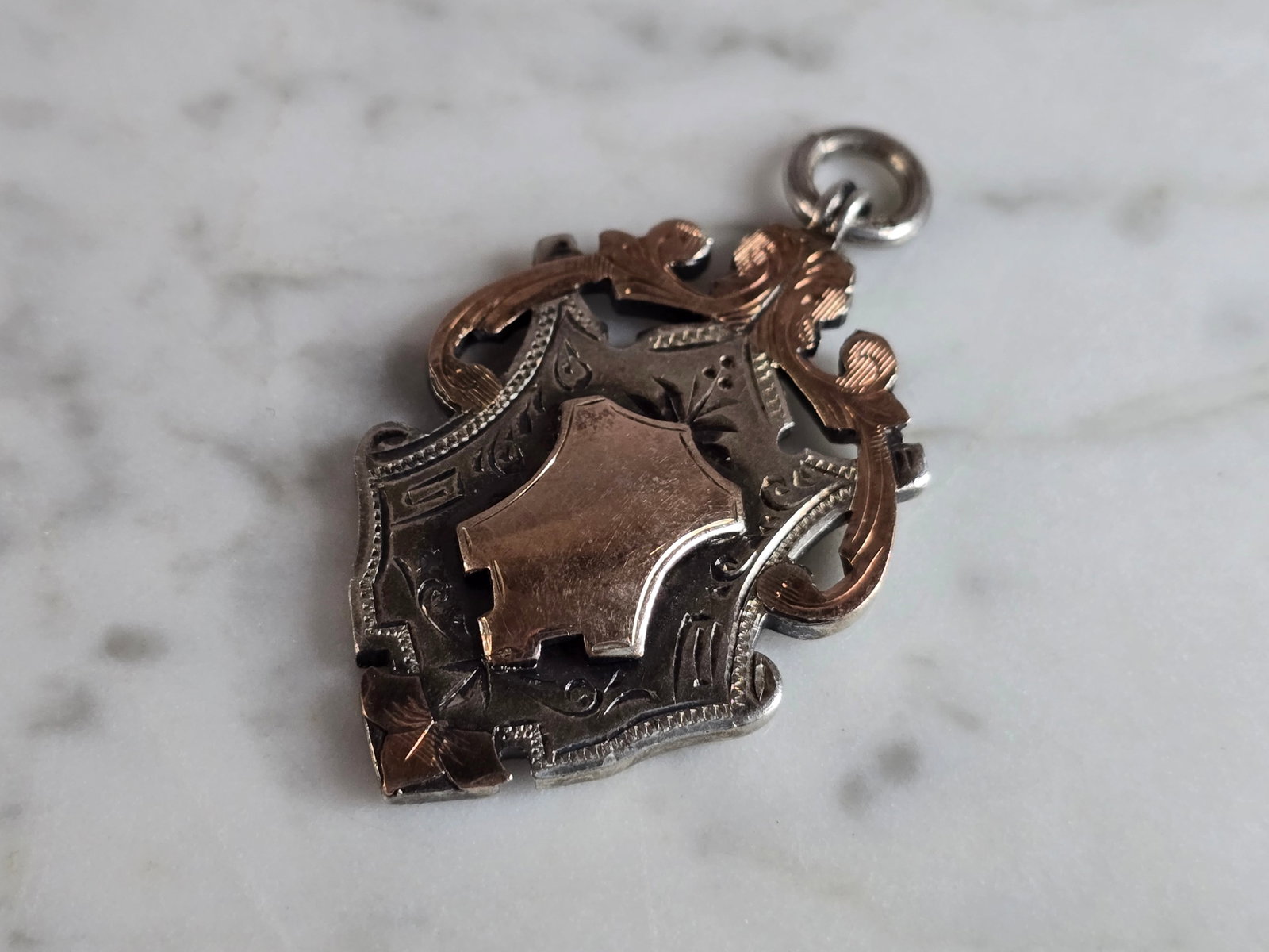 Vintage English Sterling Silver Watch Fob Medal: A VINTAGE ENGLISH STERLING SILVER WATCH FOB MEDAL THAT IS BELIEVED TO BE MADE BY HENRY GRIFFITH, 1930. FOB WEIGHS 14.5g, AND MEASURES 1 7/8" BY 1 1/16". THIS WOULD MAKE A NICE GIFT FOR THAT SOMEONE SP