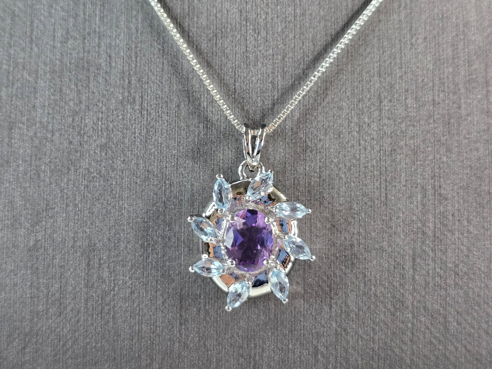 Womens Estate Sterling Silver Amethyst Topaz Pendant Necklace: A WOMENS VINTAGE ESTATE STERLING SILVER AMETHYST & TOPAZ STONE PENDANT WITH NECKLACE. TOGETHER NECKLACE AND PENDANT WEIGHS 6.0g. PENDANT MEASURES 1" LONG BY 3/4" WIDE. NECKLACE MEASURES 18". NOT SURE 
