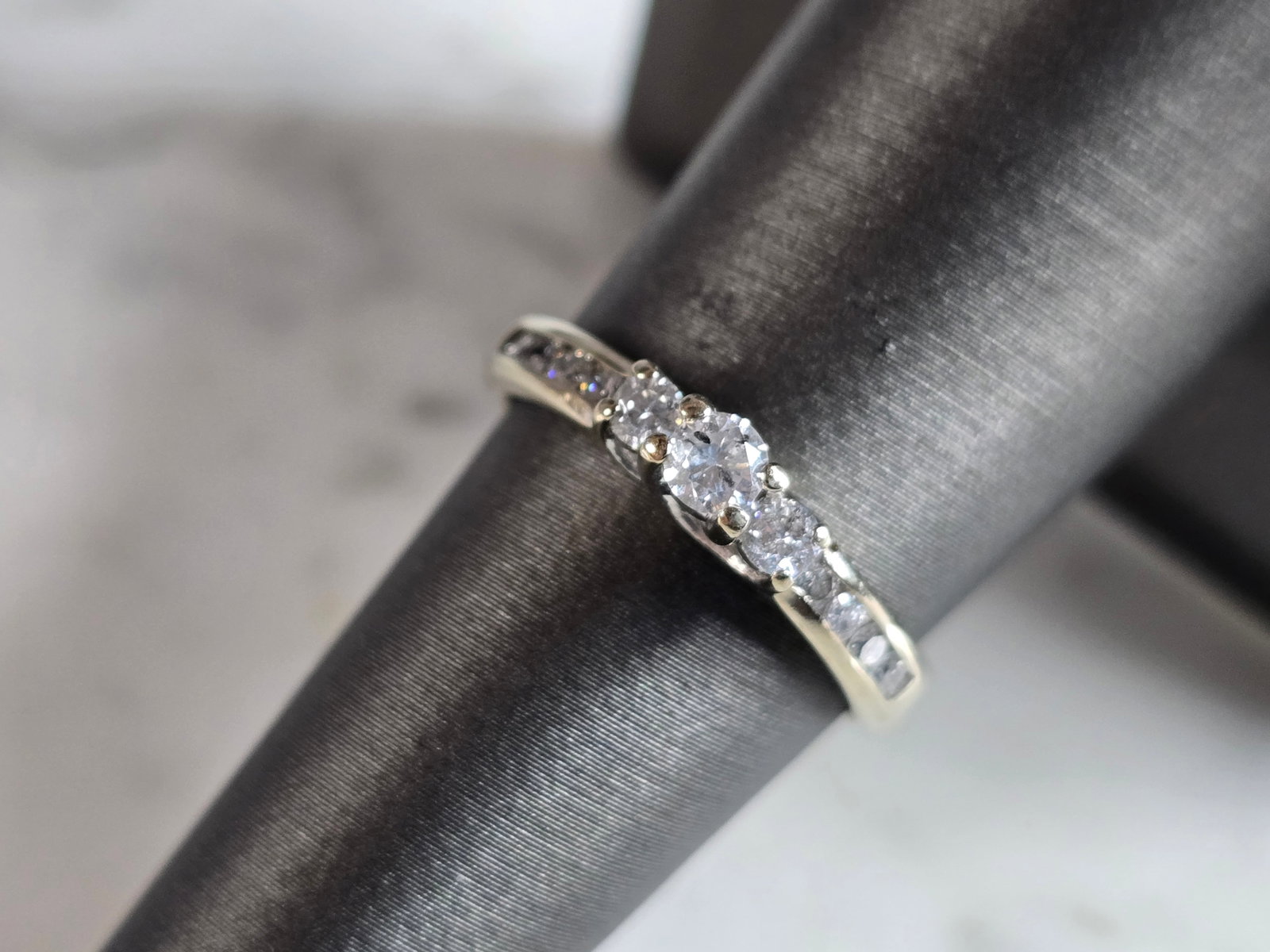 Womens Vintage Estate 10K White Gold Diamond Ring: A WOMENS VINTAGE ESTATE 10K WHITE GOLD DIAMOND RING. THERE ARE ABOUT .48cts OF DIAMONDS IN THIS RING. THE TOTAL WEIGHT IS 2.1g, AND IS A SIZE 7.0. RING IS MARKED ON THE INSIDE OF THE BAND. ANY QUESTIO