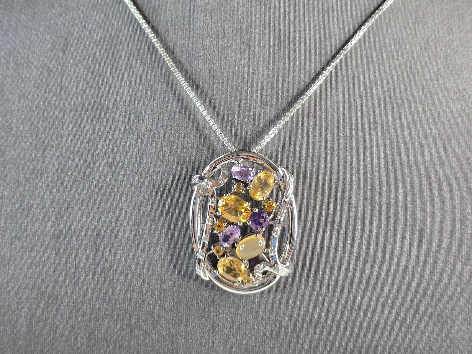 Womens Estate Sterling Silver Modernist Pendant & Necklace: A BEAUTIFUL WOMEN'S ESTATE STERLING SILVER MODERNIST PENDANT AND NECKLACE WITH CITRINE & AMETHYST STONES. THE PENDANT MEASURES 1 1/8" BY 7/8" WIDE, AND THE NECKLACE MEASURES 18". TOTAL WEIGHT IS 10.1g