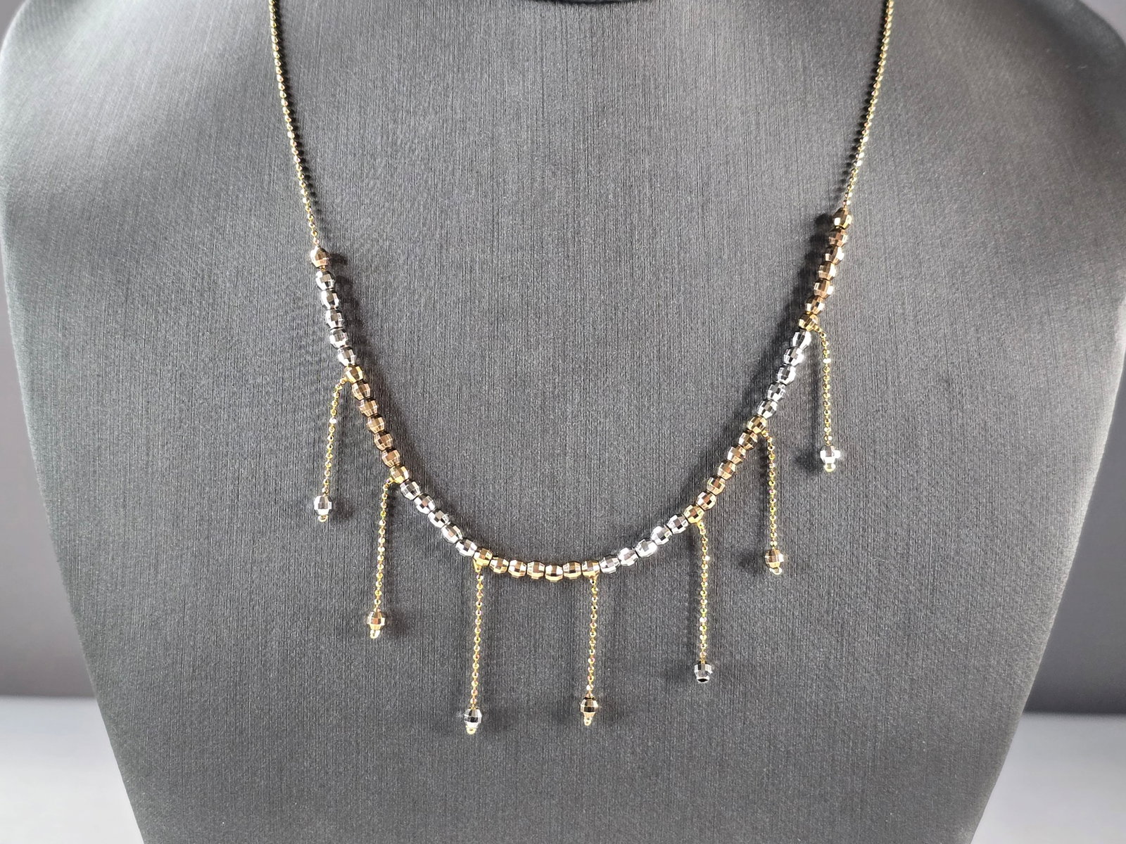 Womens Estate 14K Yellow & White Gold Modernist Beaded Necklace: A WOMENS VINTAGE ESTATE 14K YELLOW & WHITE GOLD MODERNIST BEADED NECKLACE. NECKLACE MEASURES ABOUT 16" LONG BY ABOUT 1/8" WIDE, WITH A 1" HANG. THE NECKLACE WEIGHS 5.7g. ANY QUESTIONS, PLEASE ASK. BE 
