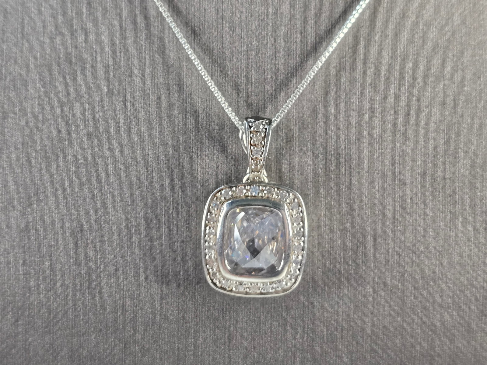 Womens Vintage Estate Sterling Silver CZ Pendant w/ Necklace: A WOMENS VINTAGE ESTATE STERLING SILVER CZ PENDANT WITH NECKLACE. TOGETHER THEY WEIGH 8.6g. THE PENDANT MEASURES 1" LONG BY 5/8" WIDE. THE NECKLACE MEASURES 18" LONG. MAKES A GREAT GIFT FOR THAT SOMEO