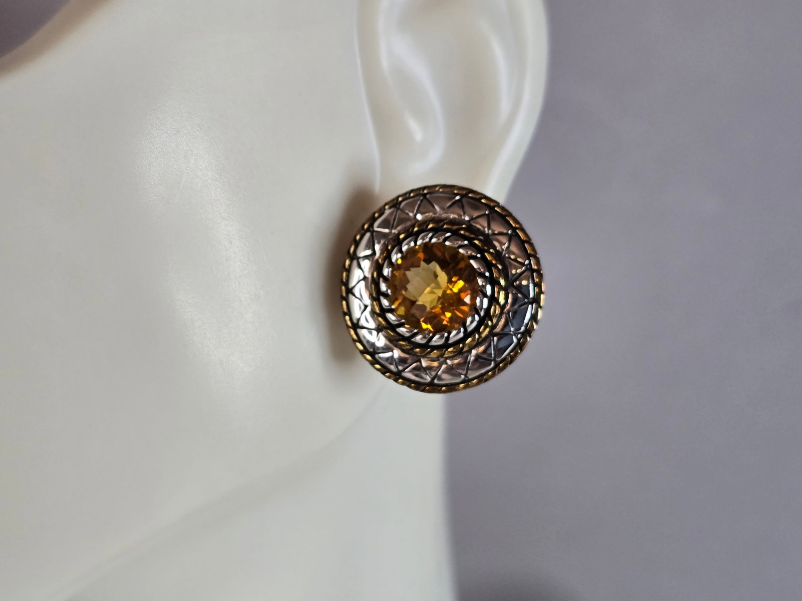 Womens Vintage Estate Sterling Silver Citrine Earrings: A PAIR OF WOMENS VINTAGE ESTATE STERLING SILVER WITH WHAT APPEARS TO BE A CITRINE STONES, NOT SURE IF STONES ARE REAL OR MAN MADE. EARRINGS WEIGH 8.1g, AND MEASURE 3/4" LONG BY 3/4" WIDE. ANY QUESTION