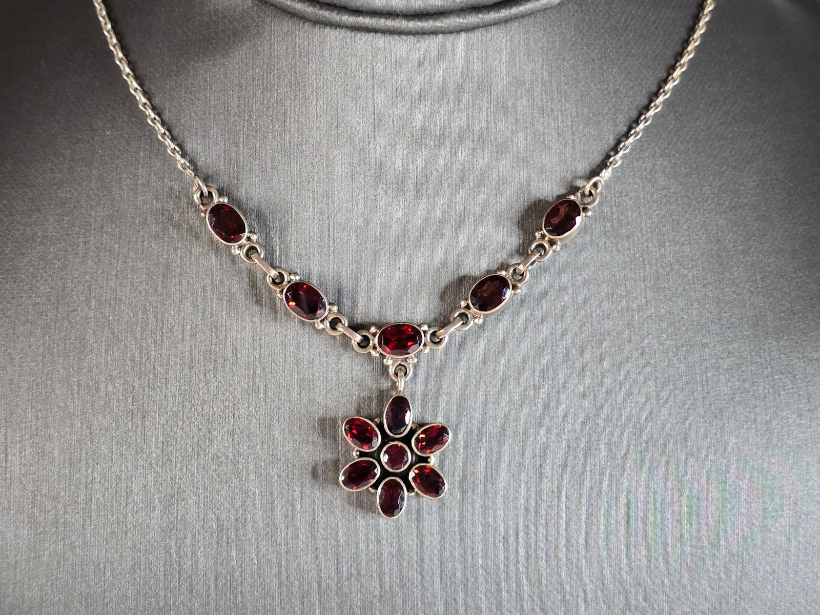 Womens Vintage Estate Sterling Silver Modernist Necklace: A WOMENS VINTAGE ESTATE STERLING SILVER MODERNIST NECKLACE. NOT SURE IF STONES ARE REAL OR MAN MADE. NECKLACE WEIGHS 11.7g AND MEASURES 17 1/2" LONG WITH AN 1 1/4" HANGING PENDANT. MAKES A GREAT GIFT 