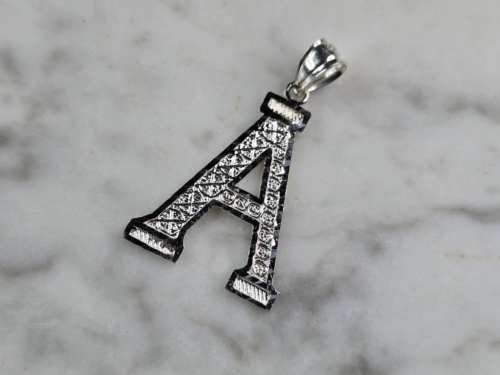 Womens Sterling Silver Initial Letter " A " Pendant: A WOMENS STERLING SILVER INITIAL LETTER "A" PENDANT. PENDANT WEIGHS 1.0g AND MEASURES 1 1/8" LONG BY 3/4" WIDE. MAKES A GREAT GIFT FOR THAT SOMEONE SPECIAL. ANY QUESTIONS, PLEASE ASK. BE SURE TO CHECK
