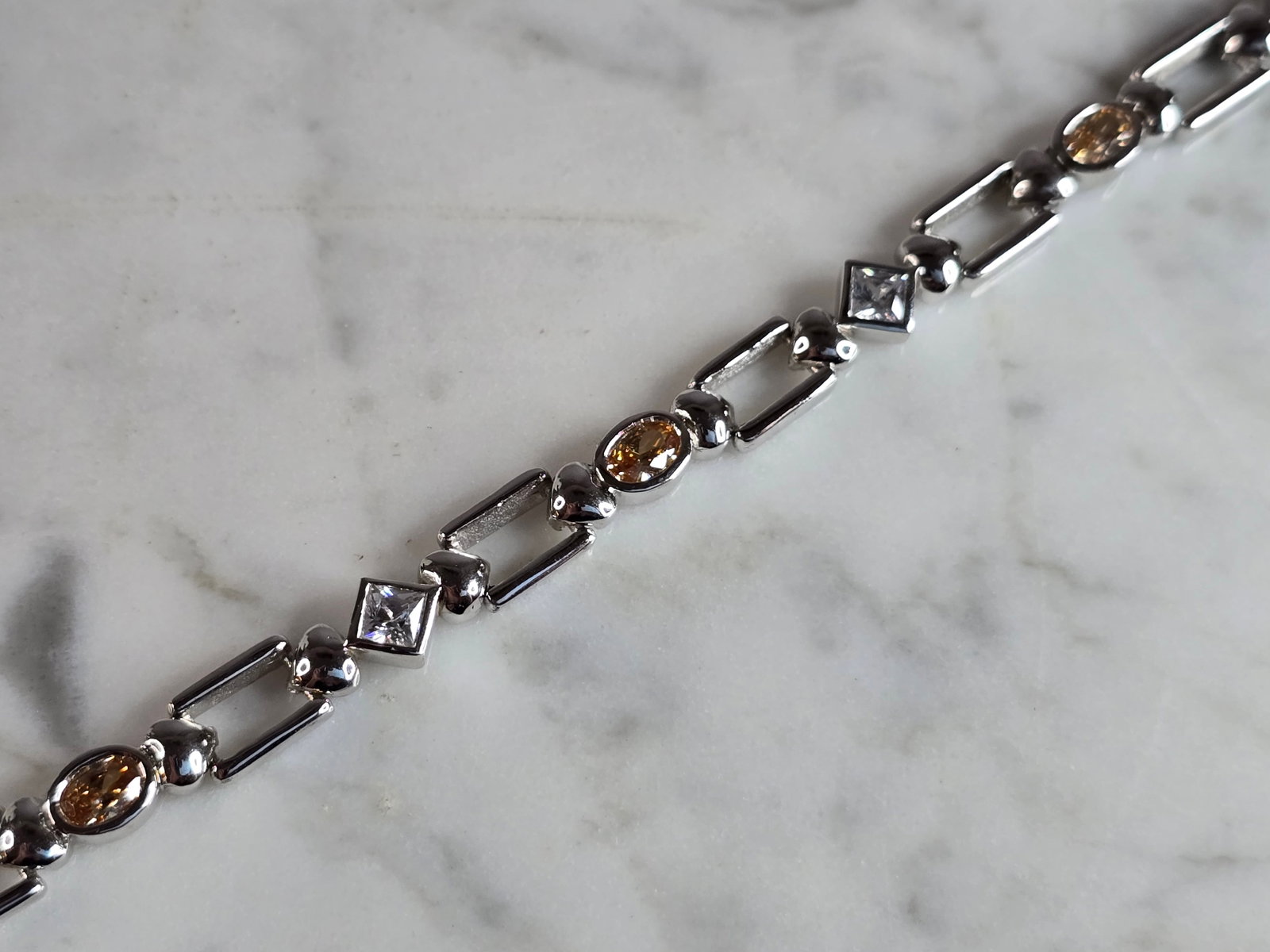 Womens Estate Sterling Silver Modernist Bracelet: A WOMENS ESTATE STERLING SILVER ROSE QUARTZ MORGANITE COLORED BRACELET. NOT SURE IF STONES ARE NATURAL OR MAN MADE. BRACELET MEASURES 8" LONG BY 1/4" WIDE, AND WEIGHS 17.2g. WOULD MAKE A LOVELY GIFT F