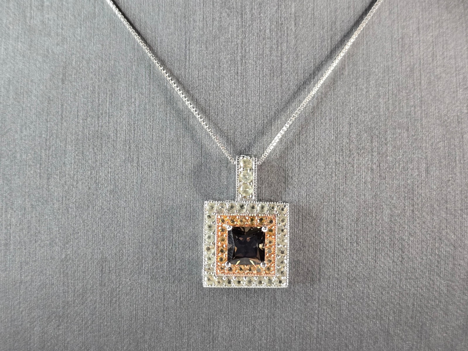 Womens Vintage Estate Sterling Silver Smoky Quartz Pendant Necklace: A WOMENS VINTAGE ESTATE STERLING SILVER SMOKY QUARTZ COLORED PENDANT WITH NECKLACE. THE TOTAL WEIGHT IS 8.5g. PENDANT MEASURES 1 1/8" LONG BY 3/4" WIDE, AND NECKLACE IS 18" LONG. NOT SURE IF THE STONE
