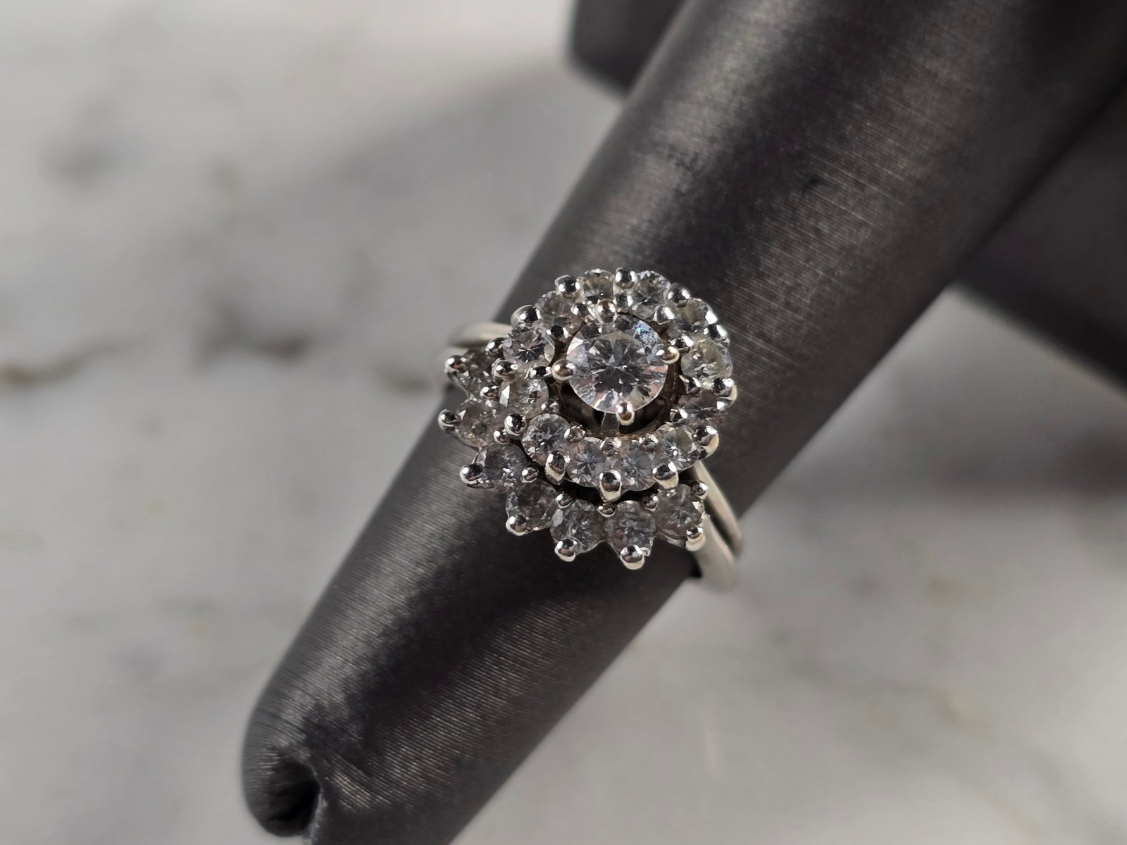 Womens Vintage Estate 14K White Gold Diamond Ring Set: A WOMENS VINTAGE ESTATE 14K WHITE GOLD DIAMOND RING SET. THE RINGS ARE A SIZE 5.0, AND WEIGH 5.5g. THE WIDTH OF THE RINGS ARE 3/8" AND 1/4". THERE ARE ABOUT 0.73cts WORTH OF DIAMONDS COMBINED. RINGS A