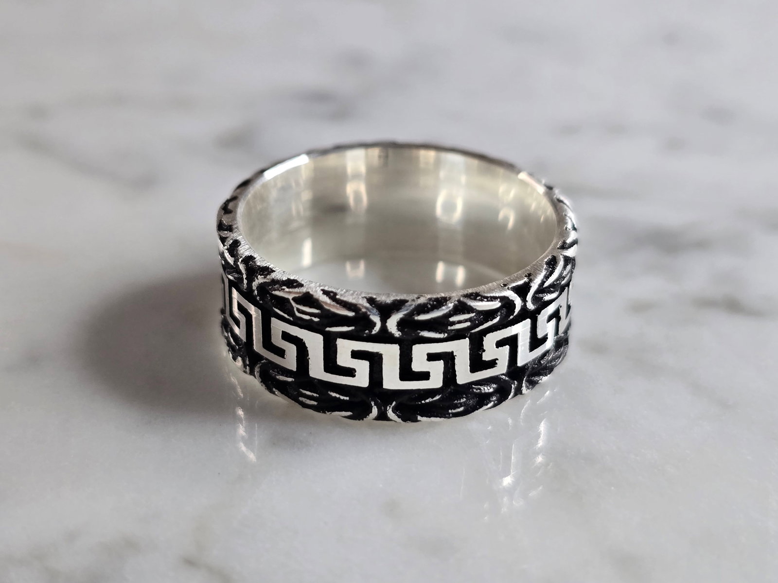 Mens Estate Sterling Silver Greek Key Band Ring: A MENS ESTATE STERLING SILVER GREEK KEY BAND RING. THE RING WEIGHS 8.2g AND IS A SIZE 11.0. BAND MEASURES 3/8" WIDE. THIS RING WOULD BE A WONDERFUL GIFT FOR THAT SPECIAL SOMEONE. ANY QUESTIONS PLEASE 