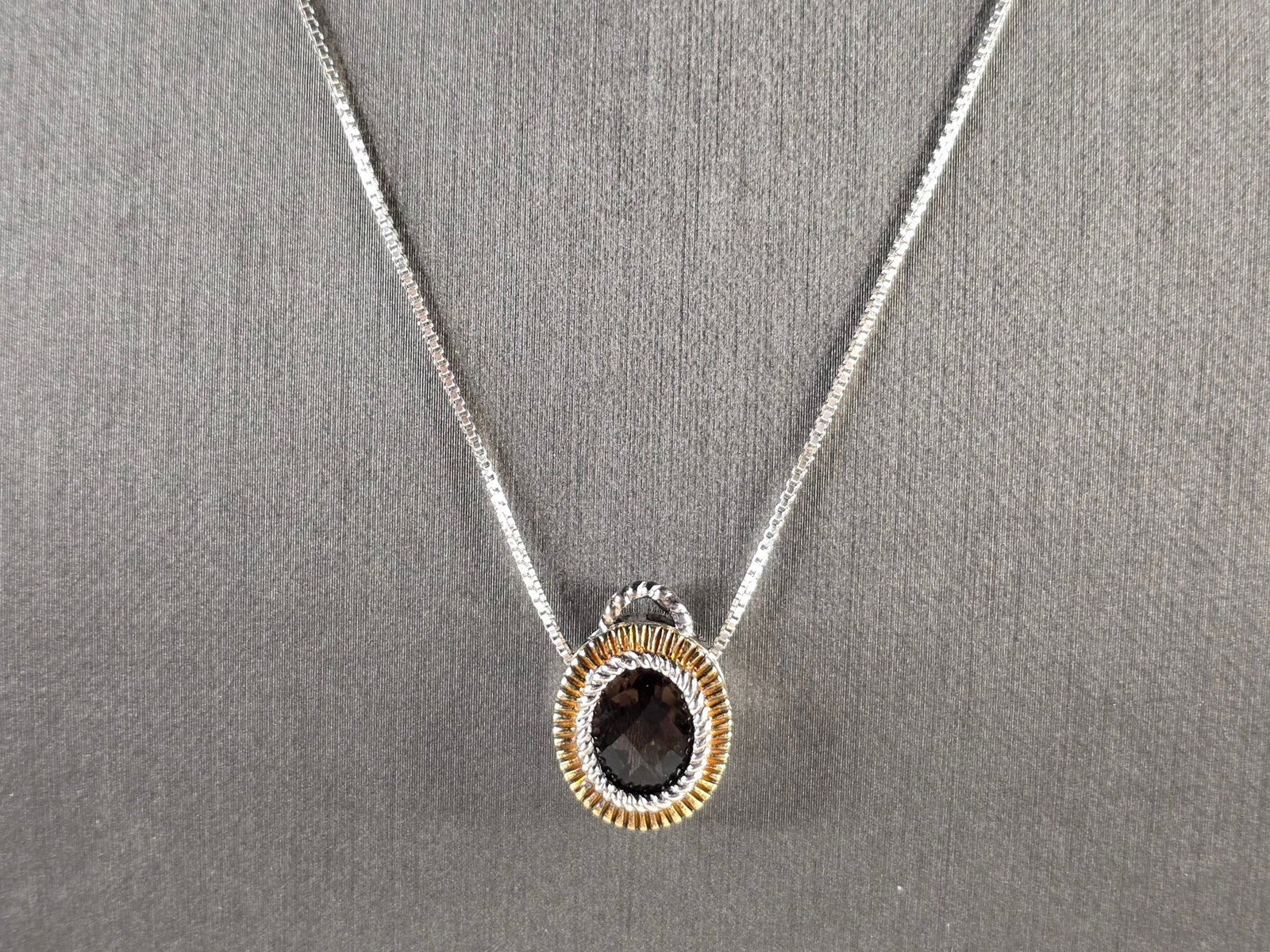 Womens Vintage Estate Sterling Silver Smoky Quartz Pendant Necklace: A WOMENS VINTAGE ESTATE GOLD TONE STERLING SILVER SMOKY QUARTZ PENDANT WITH NECKLACE. THE TOTAL WEIGHT IS 4.7g. PENDANT MEASURES 5/8" LONG BY 1/2" WIDE, AND THE NECKLACE MEASURES 18" LONG. NOT SURE IF