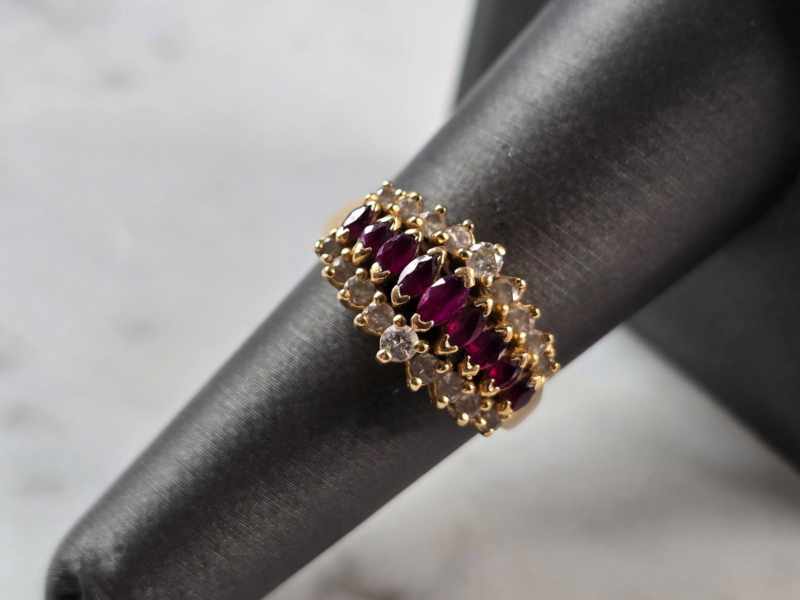 Womens Vintage Estate 14k Yellow Gold Ruby & Diamond Ring: A WOMENS VINTAGE ESTATE 14K GOLD RUBY & DIAMOND RING. THE SIZE OF THE RING IS A 7.0, AND WEIGHS 4.6g. THE WIDTH OF THE RING IS 3/8". THERE ARE 18 DIAMONDS WITH 9 RUBIES. ANY QUESTIONS PLEASE DO NOT HE