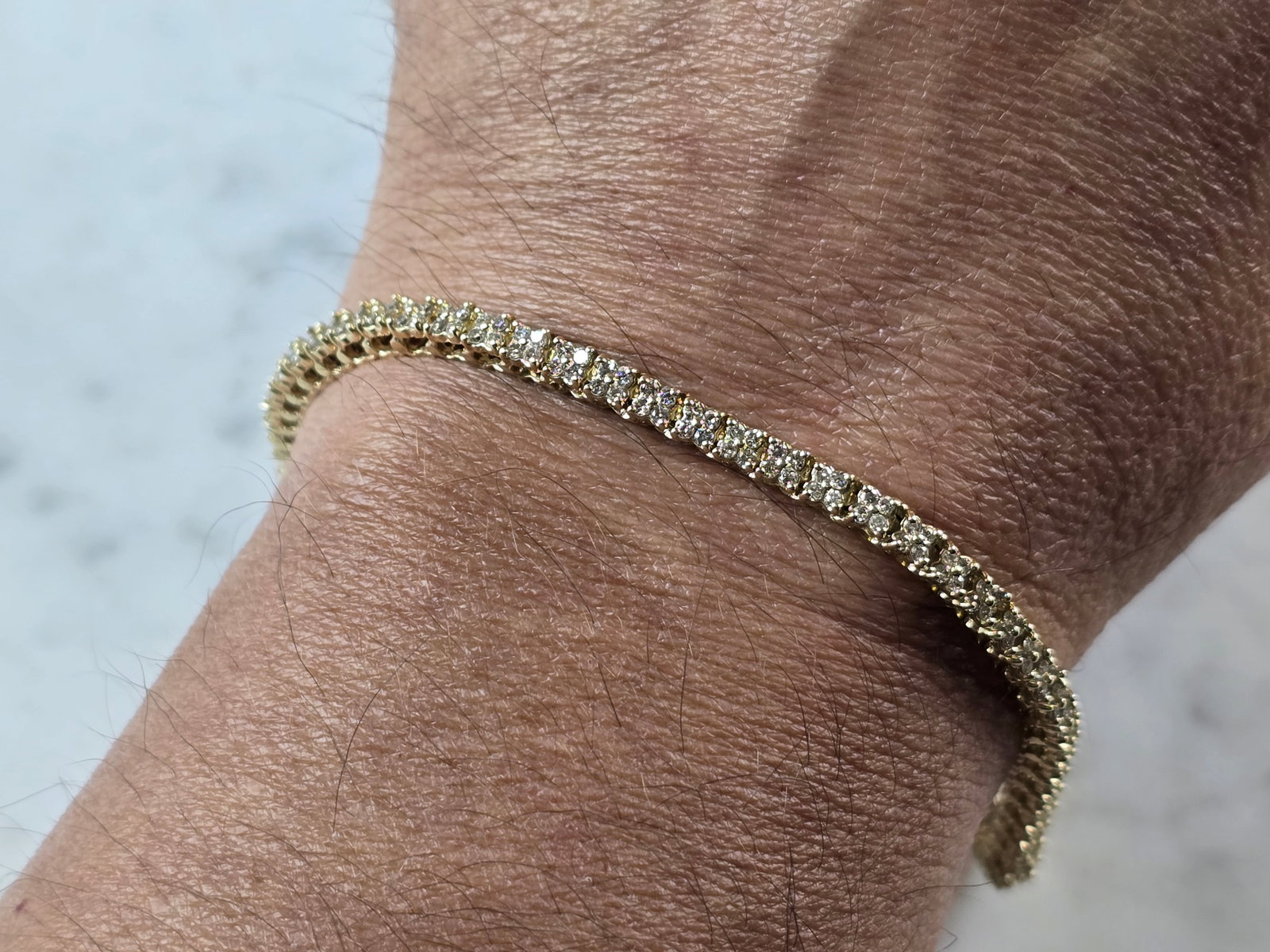 Womens Vintage Estate 14K Yellow Gold Diamond Tennis Bracelet: A WOMENS VINTAGE ESTATE 14K YELLOW GOLD DIAMOND TENNIS BRACELET. THE BRACELET MEASURES 8 1/4" LONG BY 3/16" WIDE, AND WEIGHS 12.2g. THERE ARE 224 TINY DIAMONDS IN THIS BRACELET. WOULD MAKE A GREAT GIF
